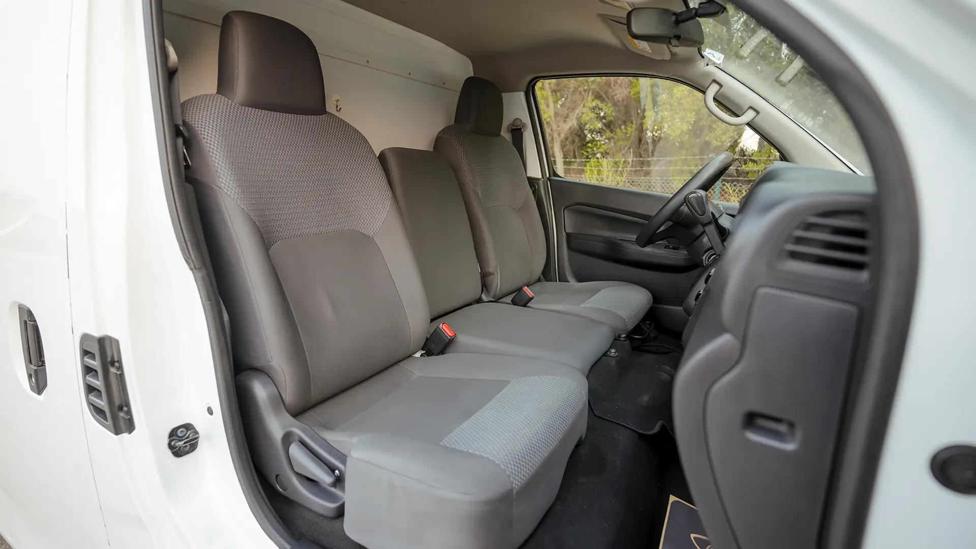 Used 2023 Nissan Urvan Standard Roof in White – Front Passenger Side Cabin View for Sale at First Choice Cars Dubai Sharjah