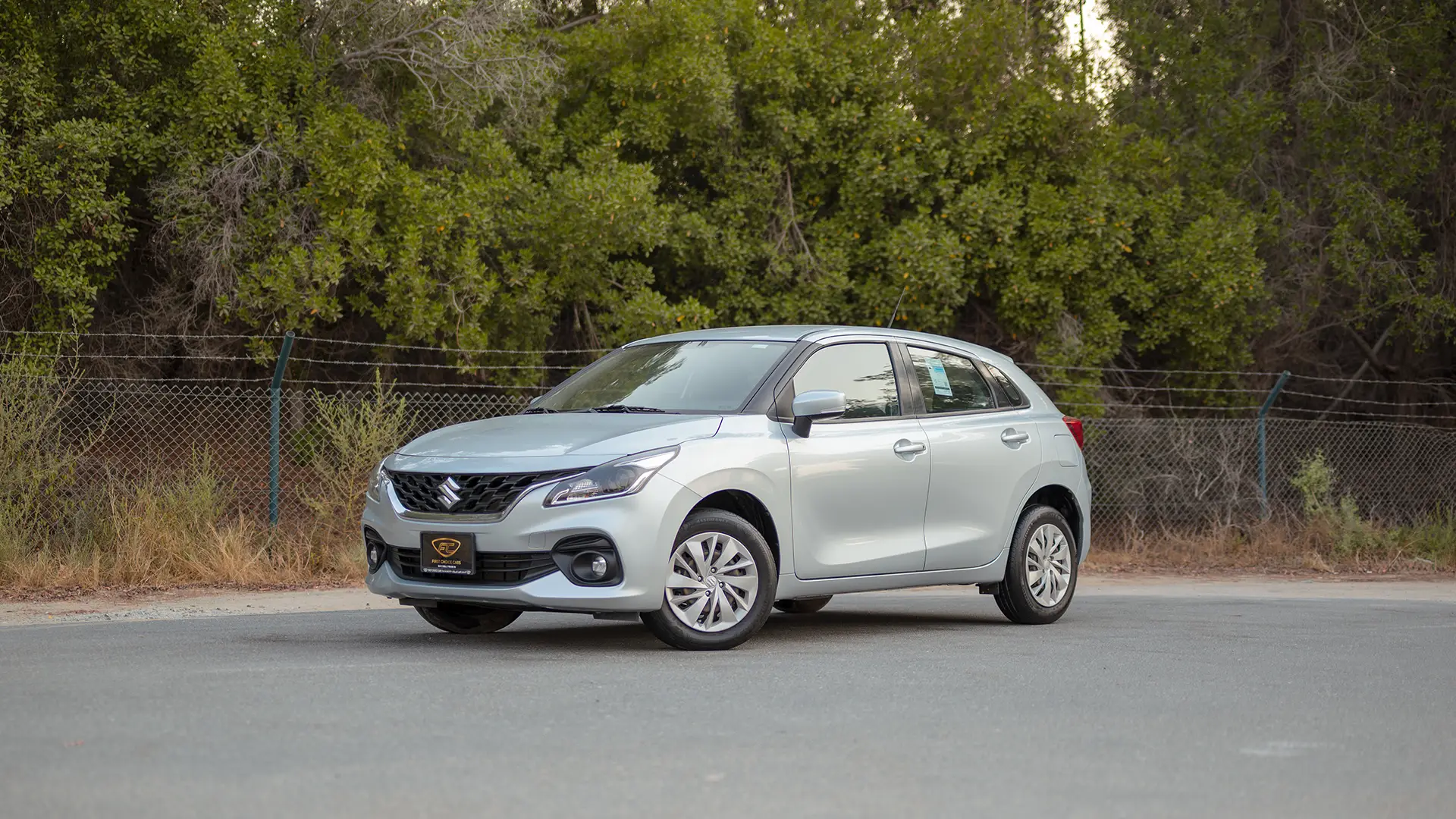 Used 2025 Suzuki Baleno GL in Silver – Left Front Diagonal (45°) View for Sale at First Choice Cars Dubai Sharjah