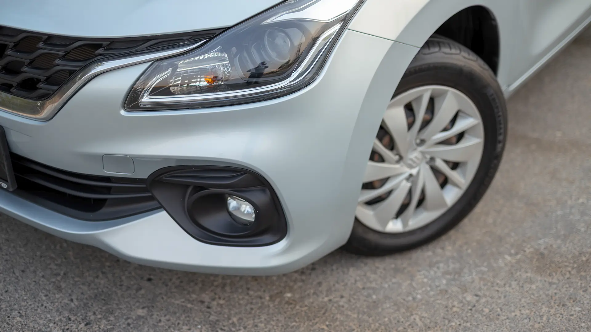 Used 2025 Suzuki Baleno GL in Silver – Headlight Close-up for Sale at First Choice Cars Dubai Sharjah