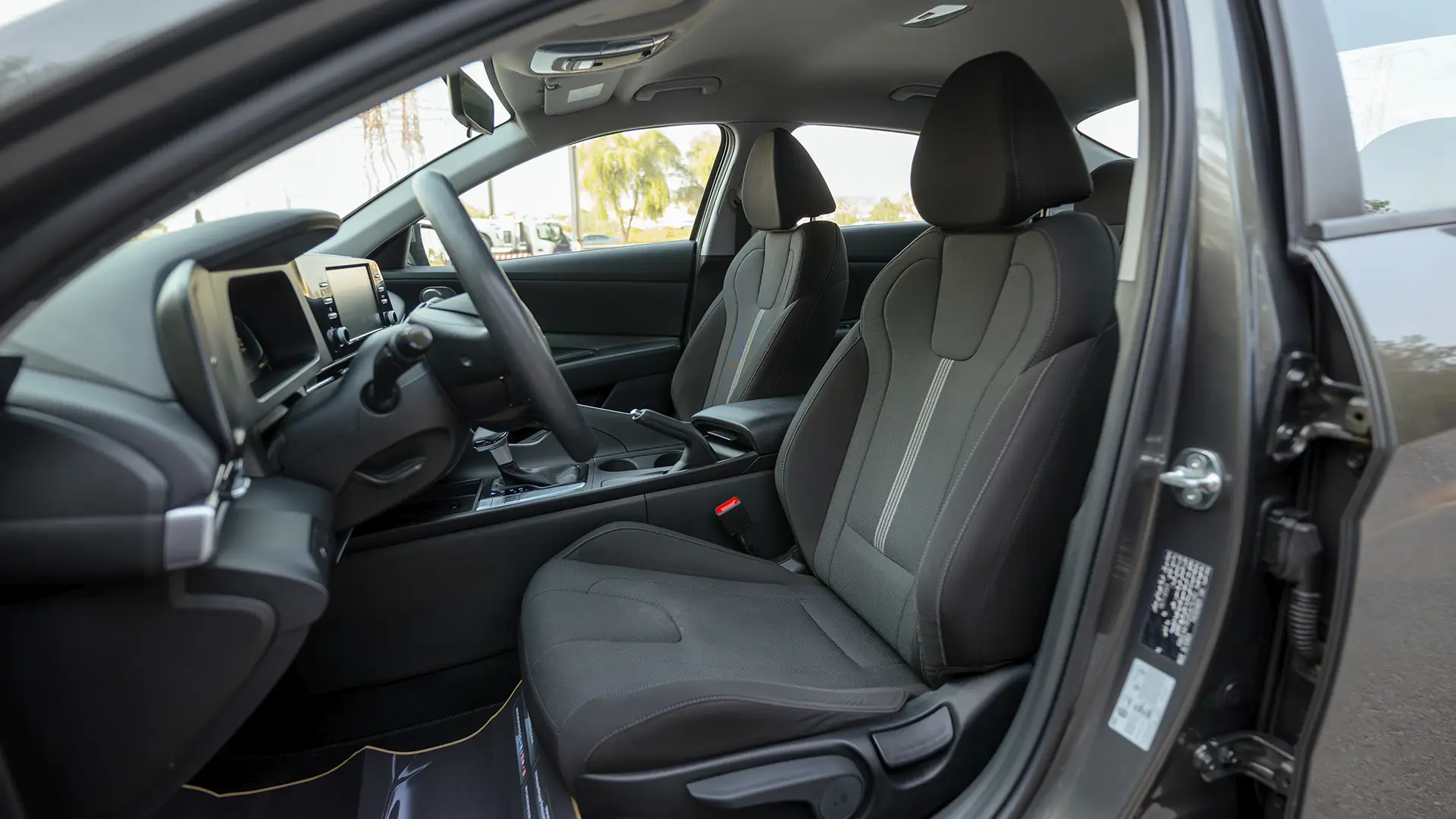 Used 2024 Hyundai Elantra Comfort in Grey – Front Driver Side Cabin View for Sale at First Choice Cars Dubai Sharjah
