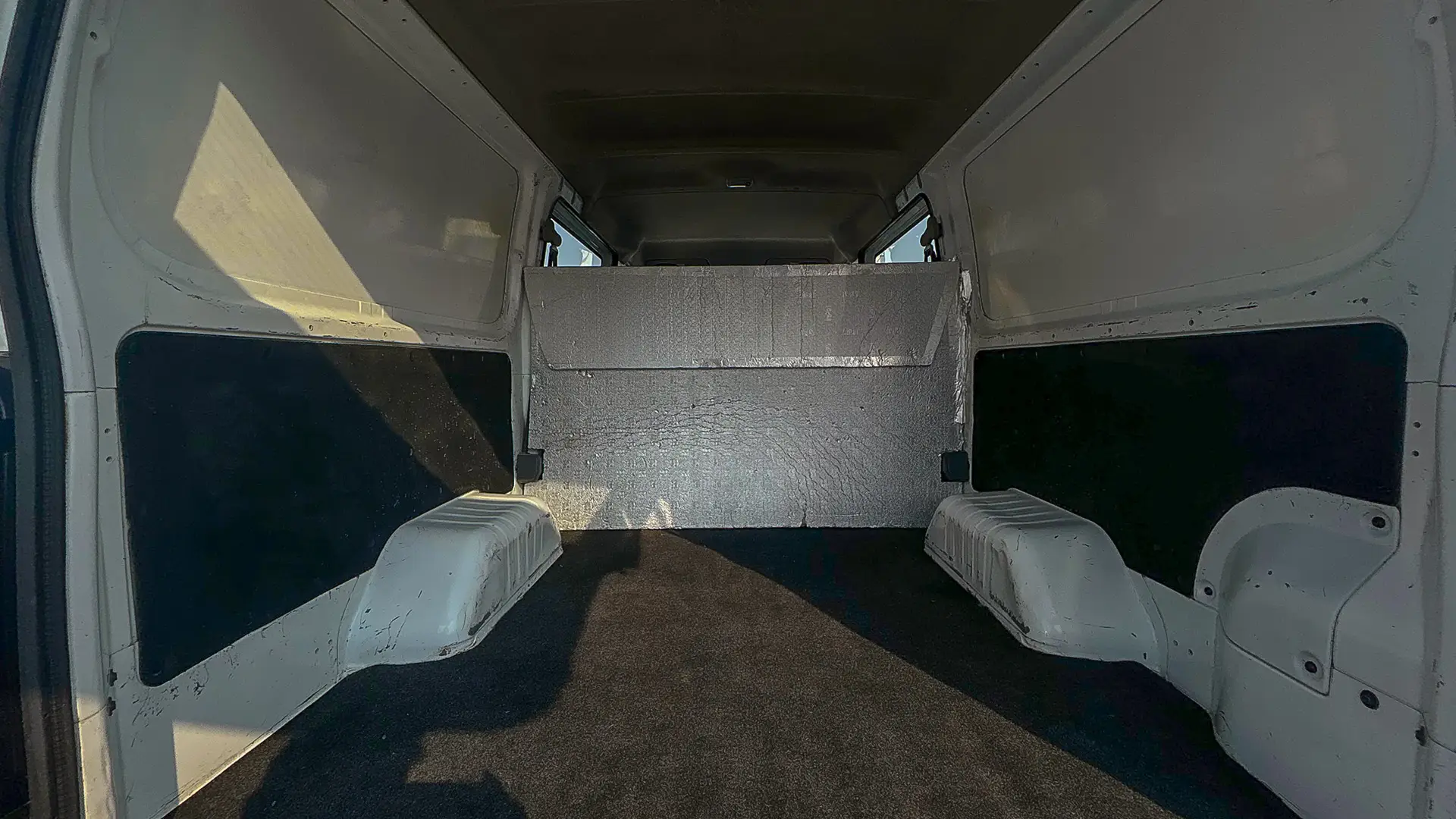 Used 2022 Nissan Urvan Standard Roof in White – Delivery Box Rear Opening View for Sale at First Choice Cars Dubai Sharjah