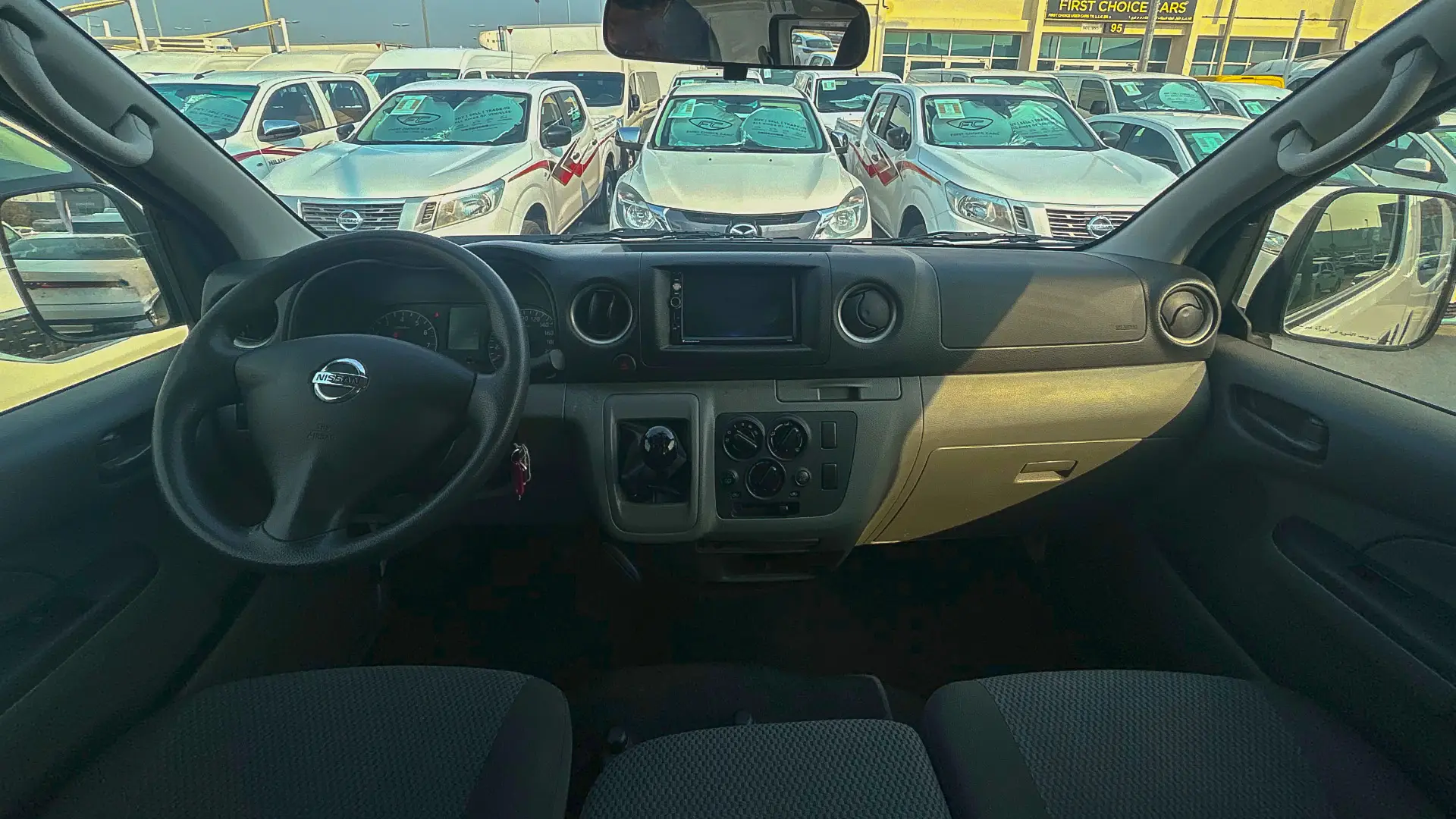 Used 2022 Nissan Urvan Standard Roof in White – Front Cabin / Dashboard Full View for Sale at First Choice Cars Dubai Sharjah