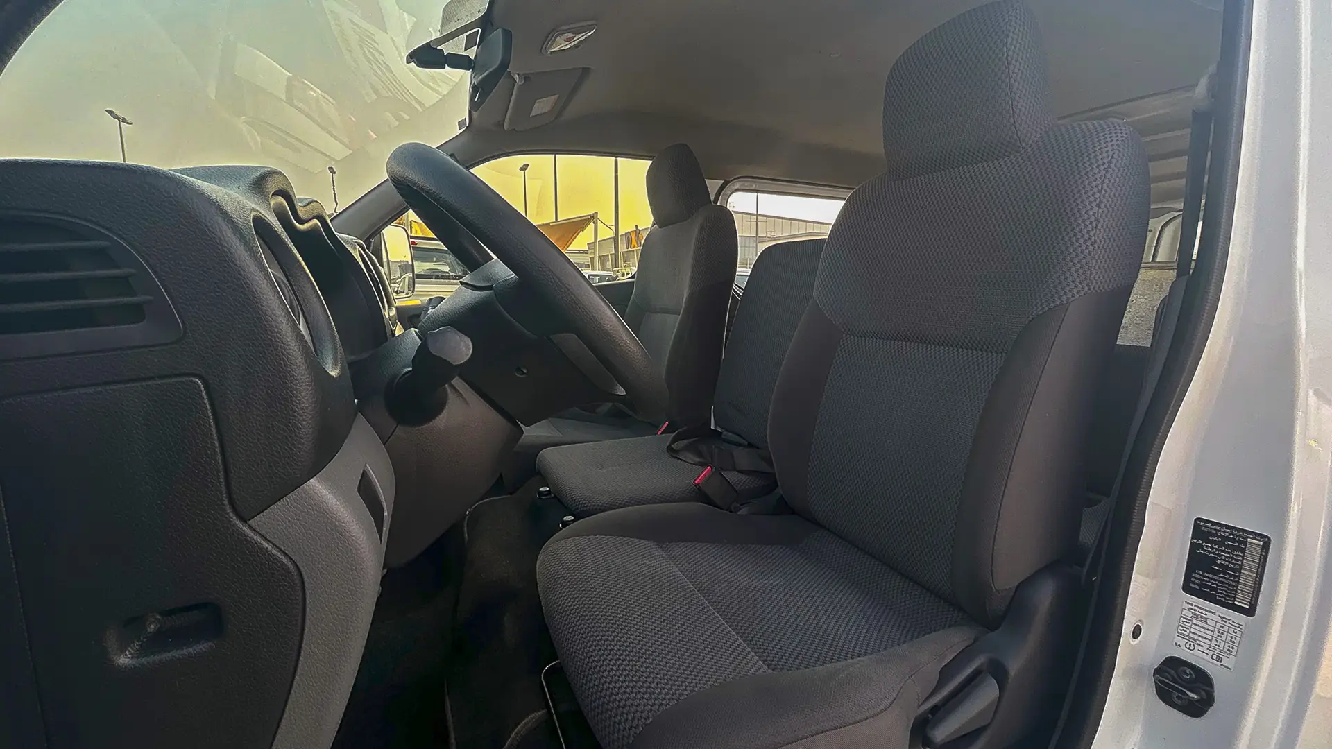 Used 2022 Nissan Urvan Standard Roof in White – Front Driver Side Cabin View for Sale at First Choice Cars Dubai Sharjah