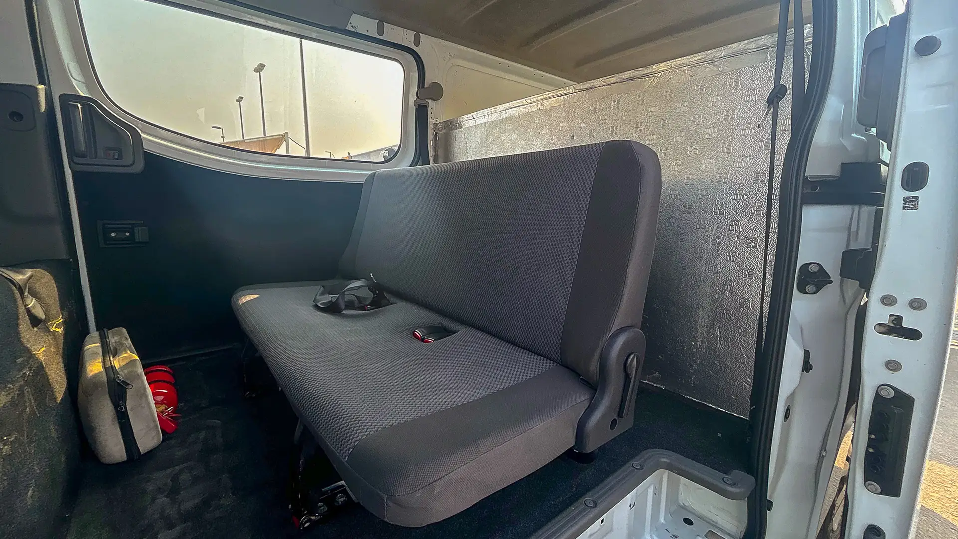Used 2022 Nissan Urvan Standard Roof in White – Rear Passenger Side Cabin View for Sale at First Choice Cars Dubai Sharjah