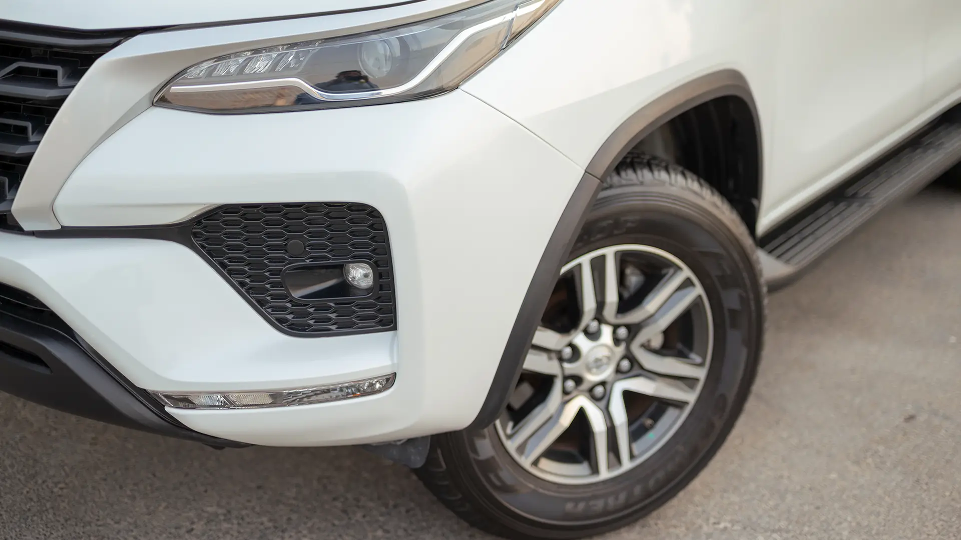 Used 2025 Toyota Fortuner EXR in White – Headlight Close-up for Sale at First Choice Cars Dubai Sharjah