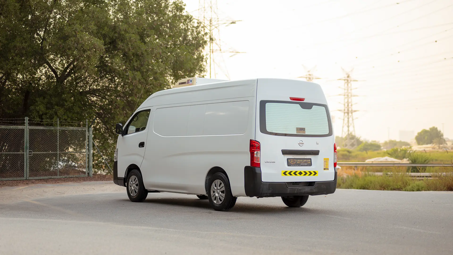 Used 2022 Nissan Urvan High Roof in White – Left Back Diagonal (45°) View for Sale at First Choice Cars Dubai Sharjah