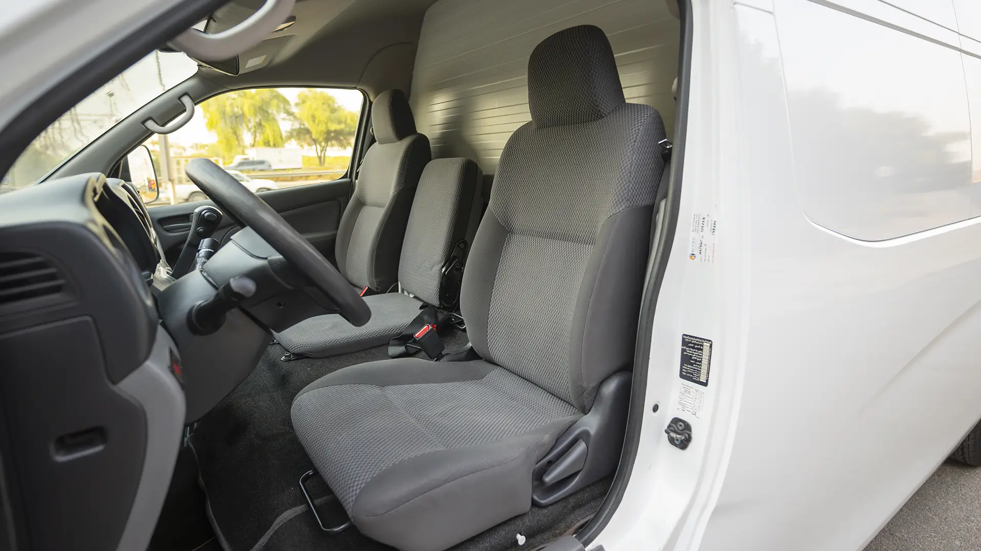 Used 2022 Nissan Urvan High Roof in White – Front Driver Side Cabin View for Sale at First Choice Cars Dubai Sharjah