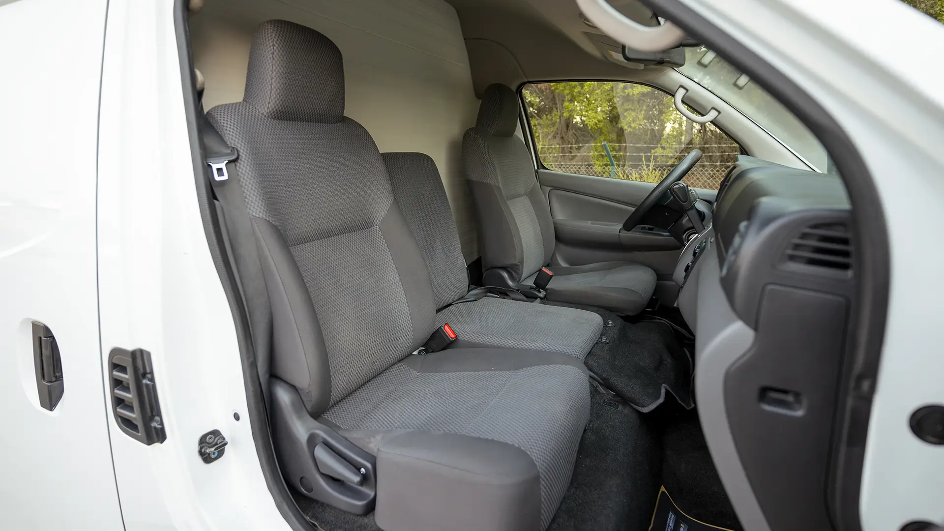 Used 2022 Nissan Urvan High Roof in White – Front Passenger Side Cabin View for Sale at First Choice Cars Dubai Sharjah