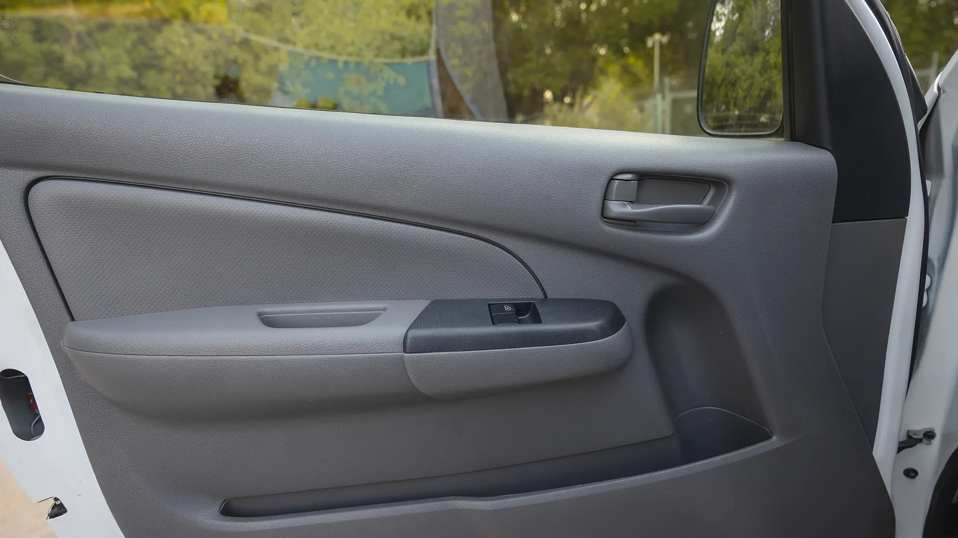 Used 2022 Nissan Urvan High Roof in White – Driver Door Panel Full View for Sale at First Choice Cars Dubai Sharjah