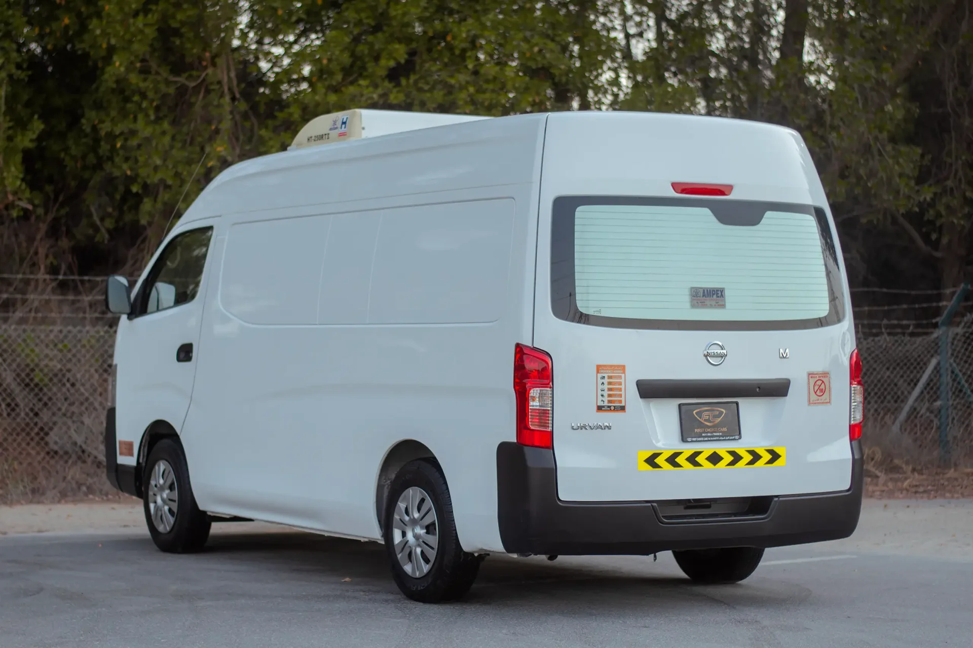 Used 2022 Nissan Urvan High Roof in White – Left Back Diagonal (45°) View for Sale at First Choice Cars Dubai Sharjah