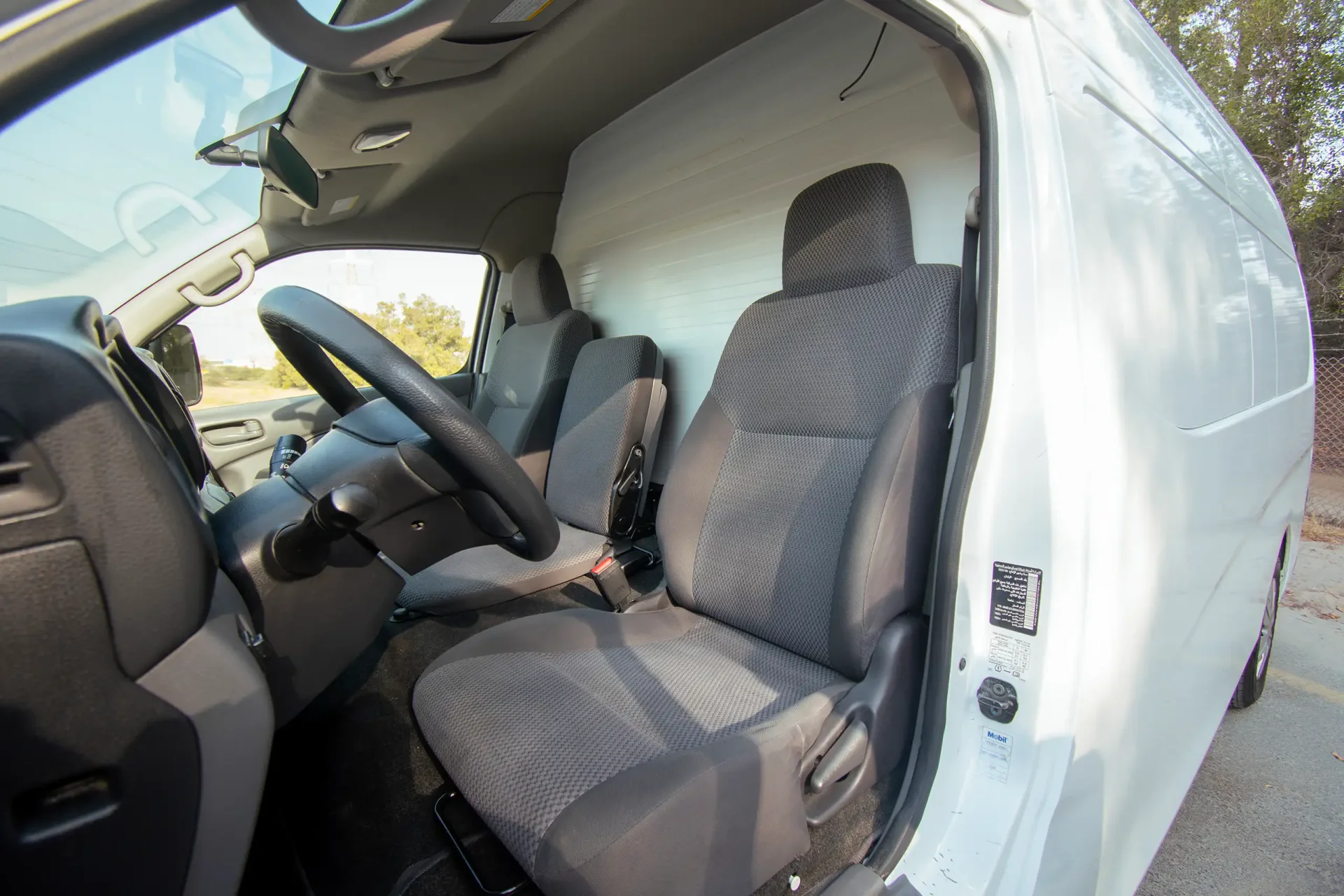 Used 2022 Nissan Urvan High Roof in White – Front Driver Side Cabin View for Sale at First Choice Cars Dubai Sharjah