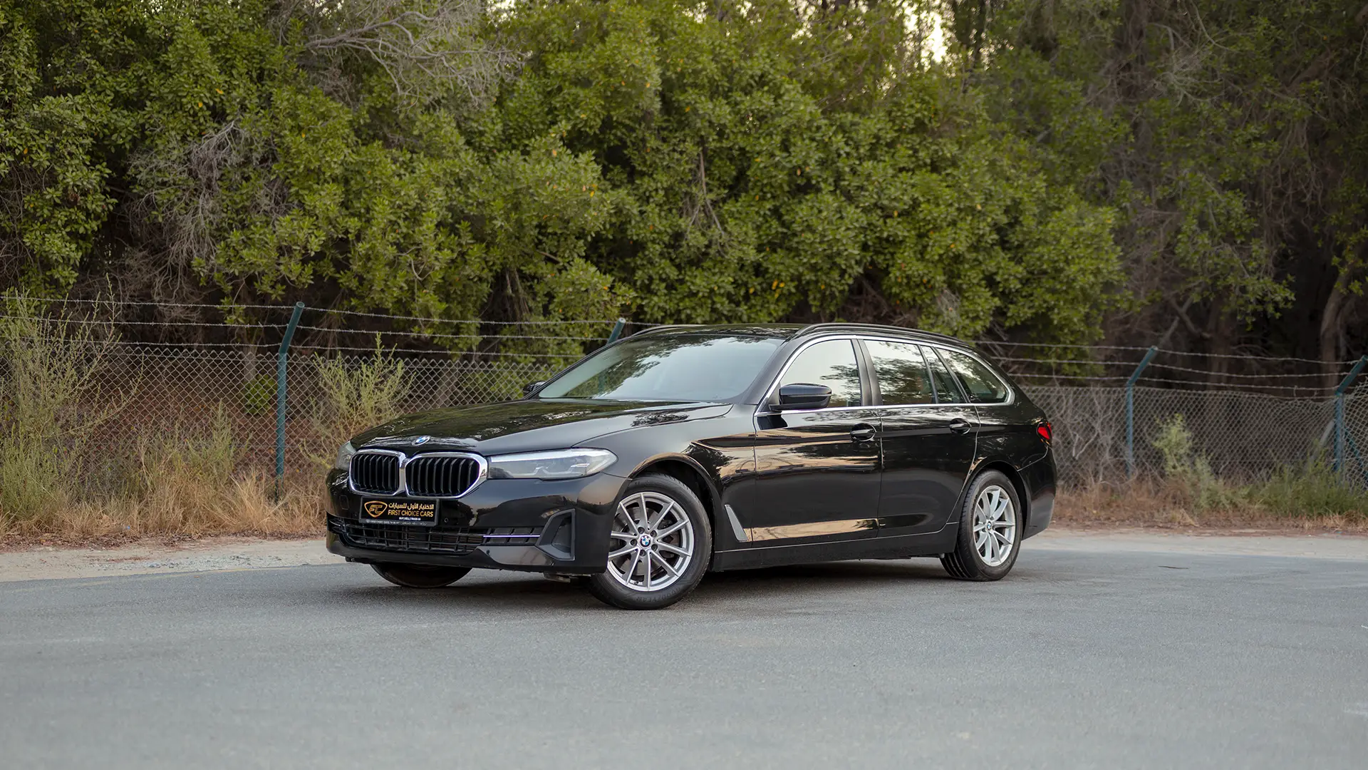 Used 2023 BMW 5-Series 520i in Black – Left Front Diagonal (45°) View for Sale at First Choice Cars Dubai Sharjah