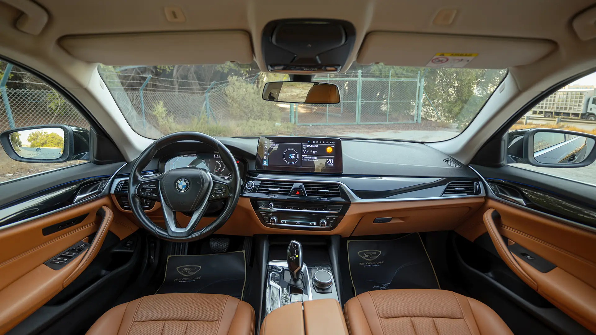 Used 2023 BMW 5-Series 520i in Black – Front Cabin / Dashboard Full View for Sale at First Choice Cars Dubai Sharjah