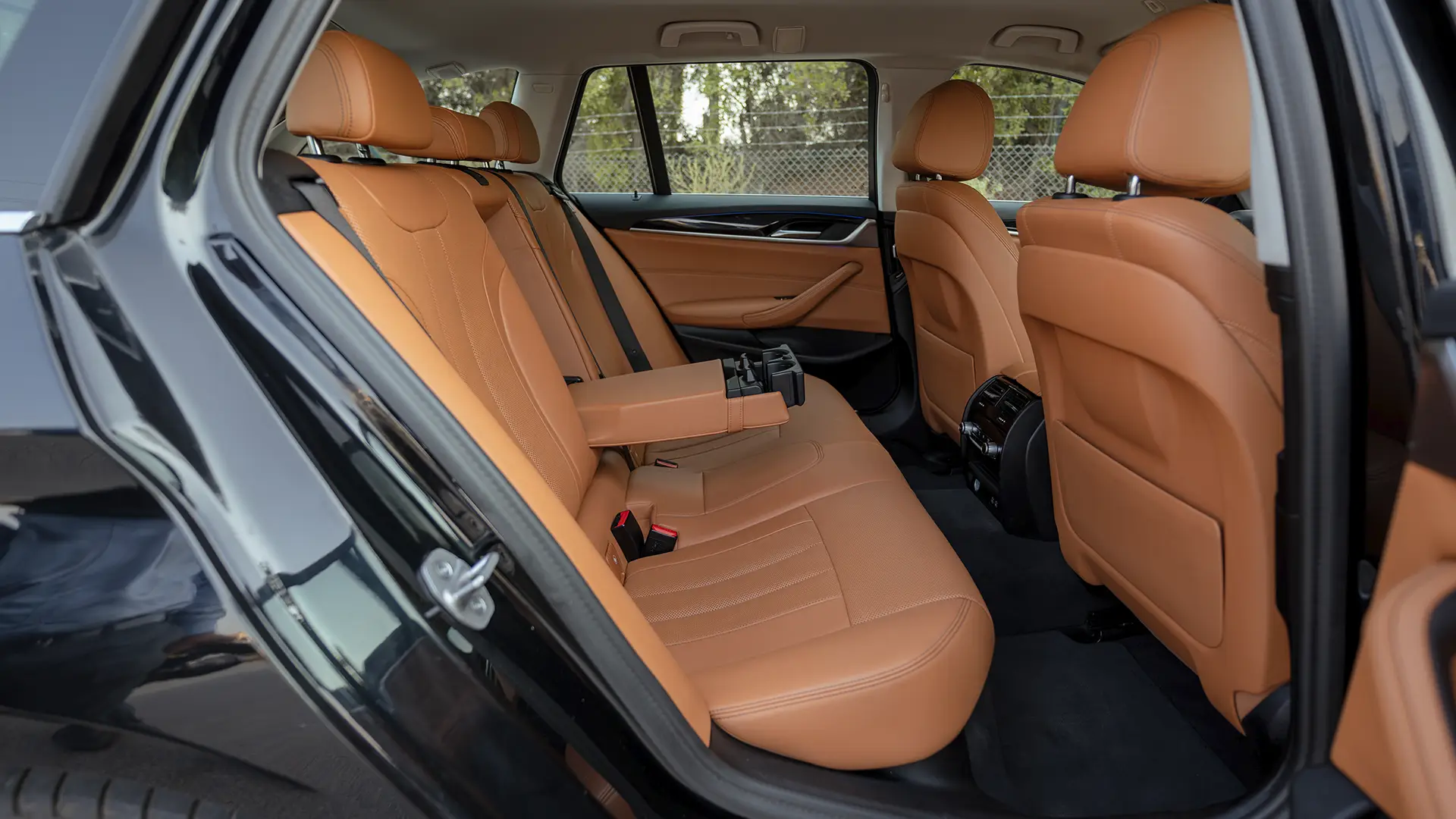 Used 2023 BMW 5-Series 520i in Black – Rear Passenger Side Cabin View for Sale at First Choice Cars Dubai Sharjah