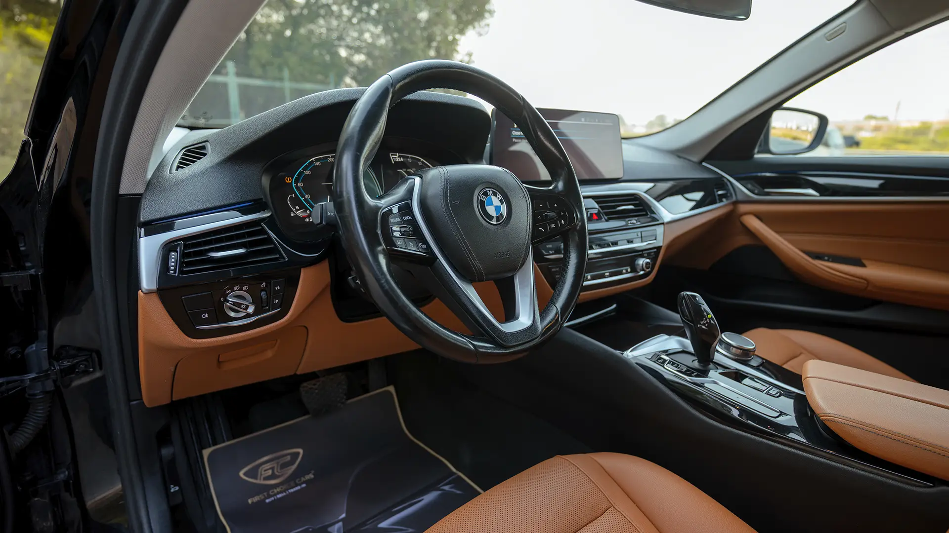 Used 2023 BMW 5-Series 520i in Black – Driver Side Dashboard & Steering View for Sale at First Choice Cars Dubai Sharjah