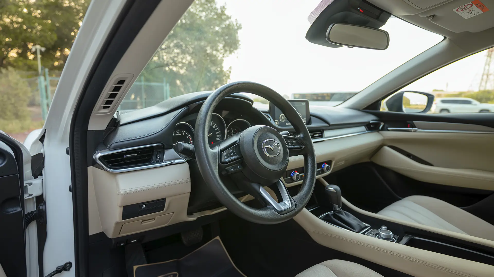 Used 2024 Mazda 6 Pure in White – Driver Side Dashboard & Steering View for Sale at First Choice Cars Dubai Sharjah