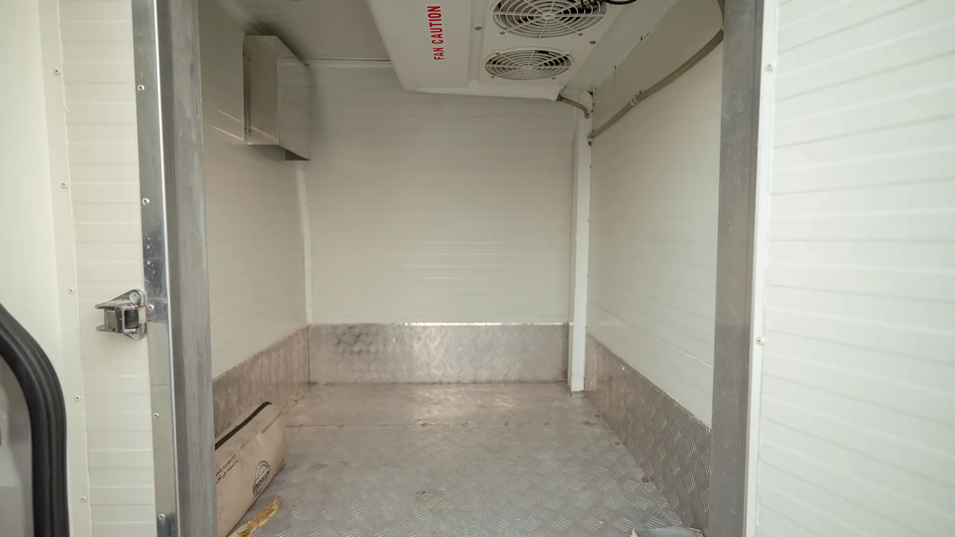Used 2023 Nissan Urvan High Roof in White – Freezer Box Right Side Interior View for Sale at First Choice Cars Dubai Sharjah