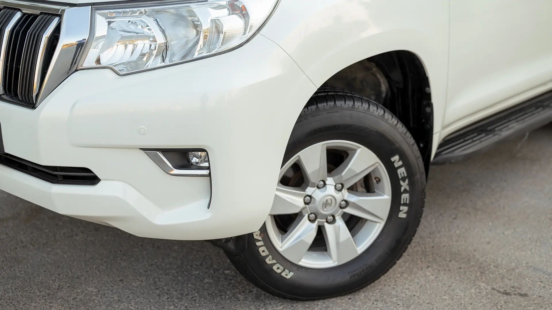 Used 2022 Toyota Prado EXR in White – Headlight Close-up for Sale at First Choice Cars Dubai Sharjah
