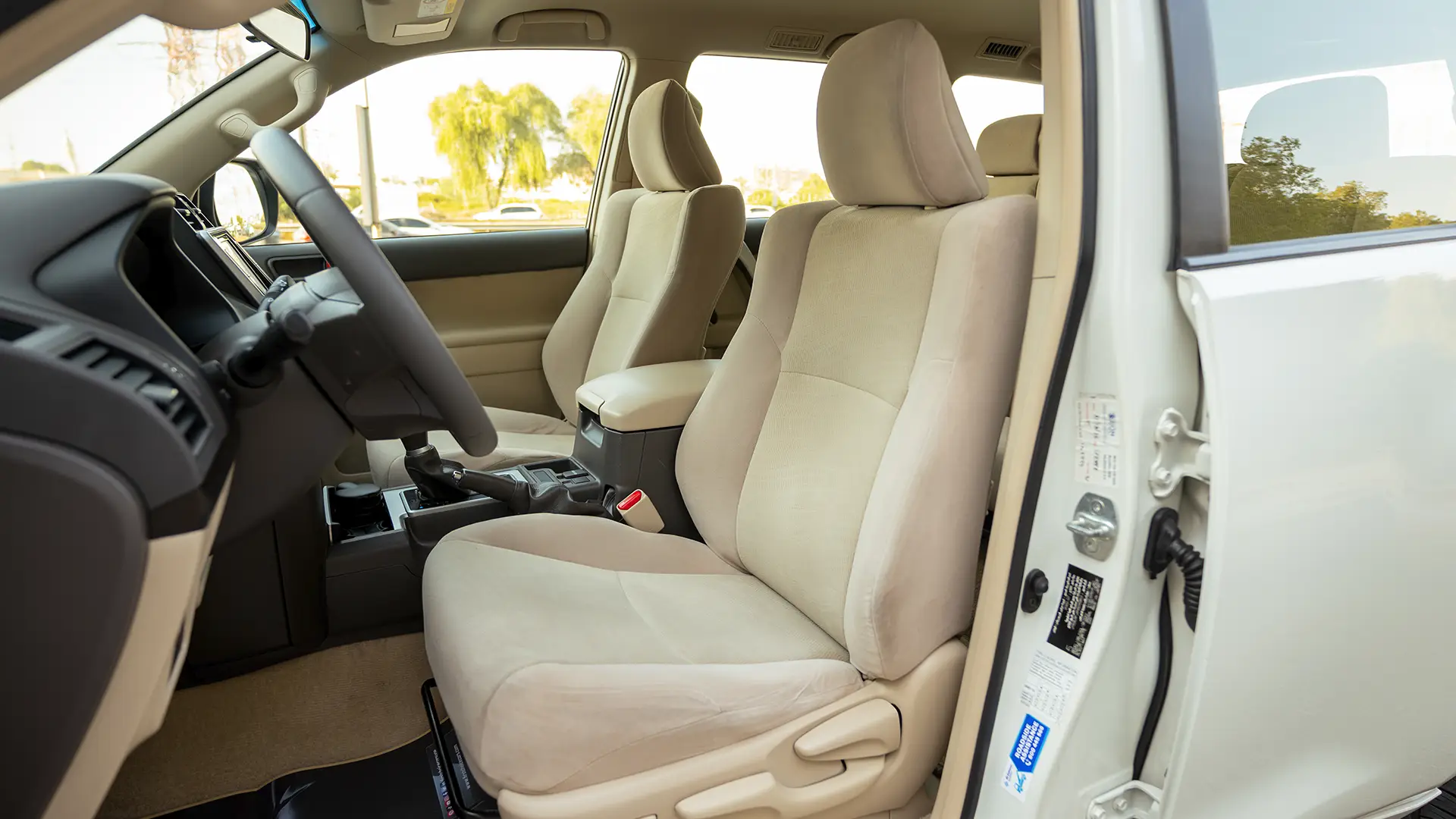 Used 2022 Toyota Prado EXR in White – Front Driver Side Cabin View for Sale at First Choice Cars Dubai Sharjah