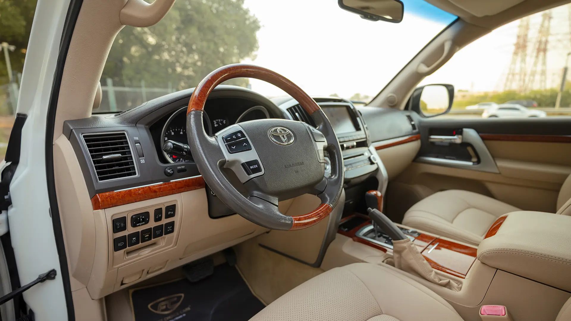 Used 2014 Toyota Land Cruiser VXR in White – Driver Side Dashboard & Steering View for Sale at First Choice Cars Dubai Sharjah