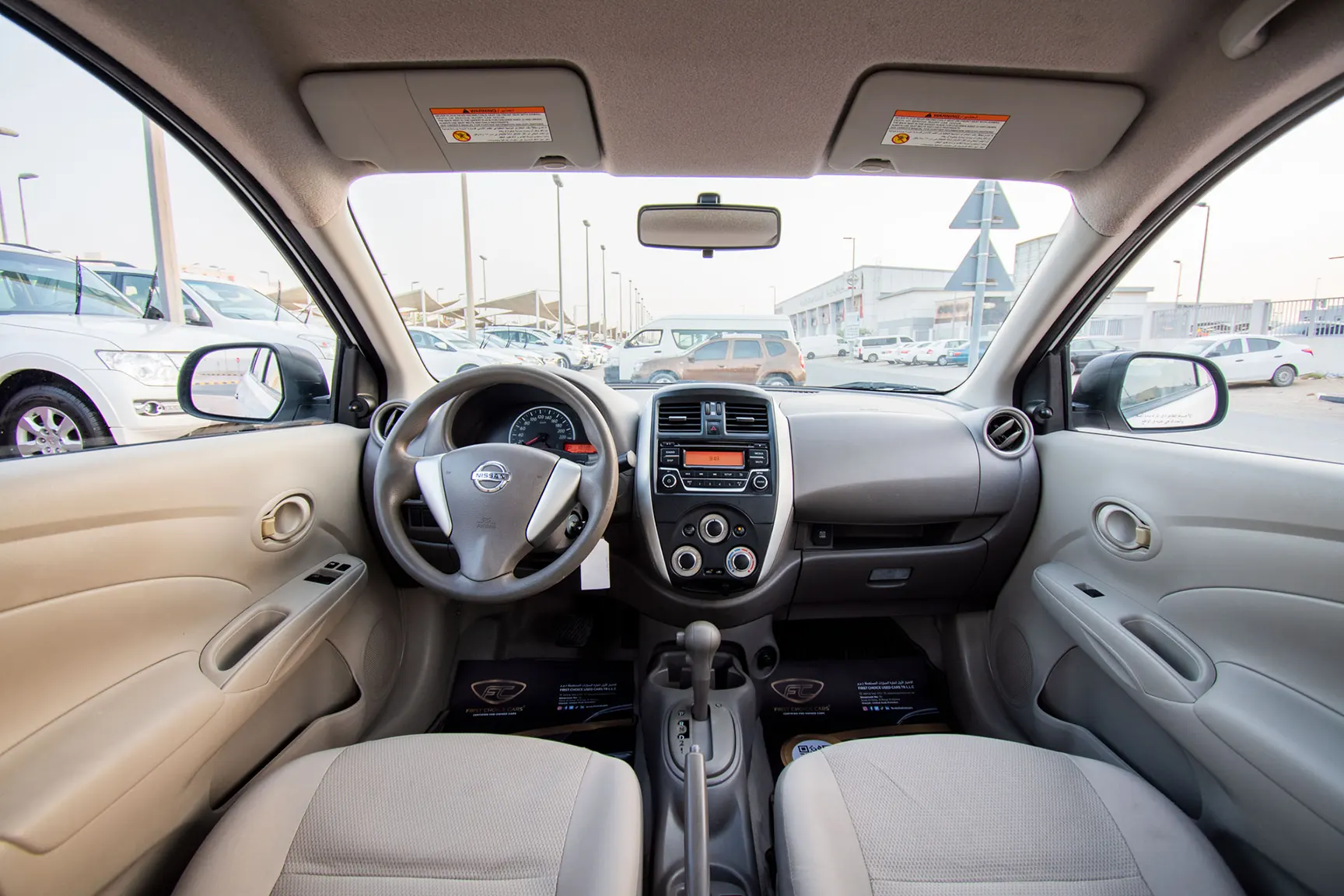 Used 2018 Nissan Sunny S White – Front Cabin / Dashboard Full View at First Choice Cars Sharjah