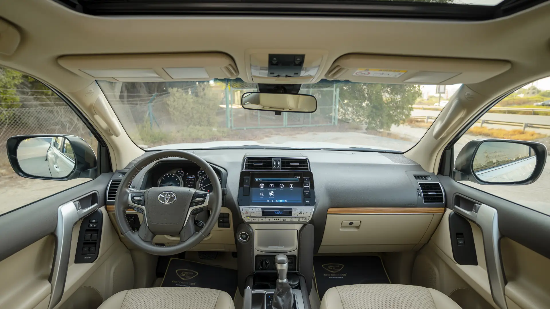 Used 2023 Toyota Prado VXR in White – Front Cabin / Dashboard Full View for Sale at First Choice Cars Dubai Sharjah