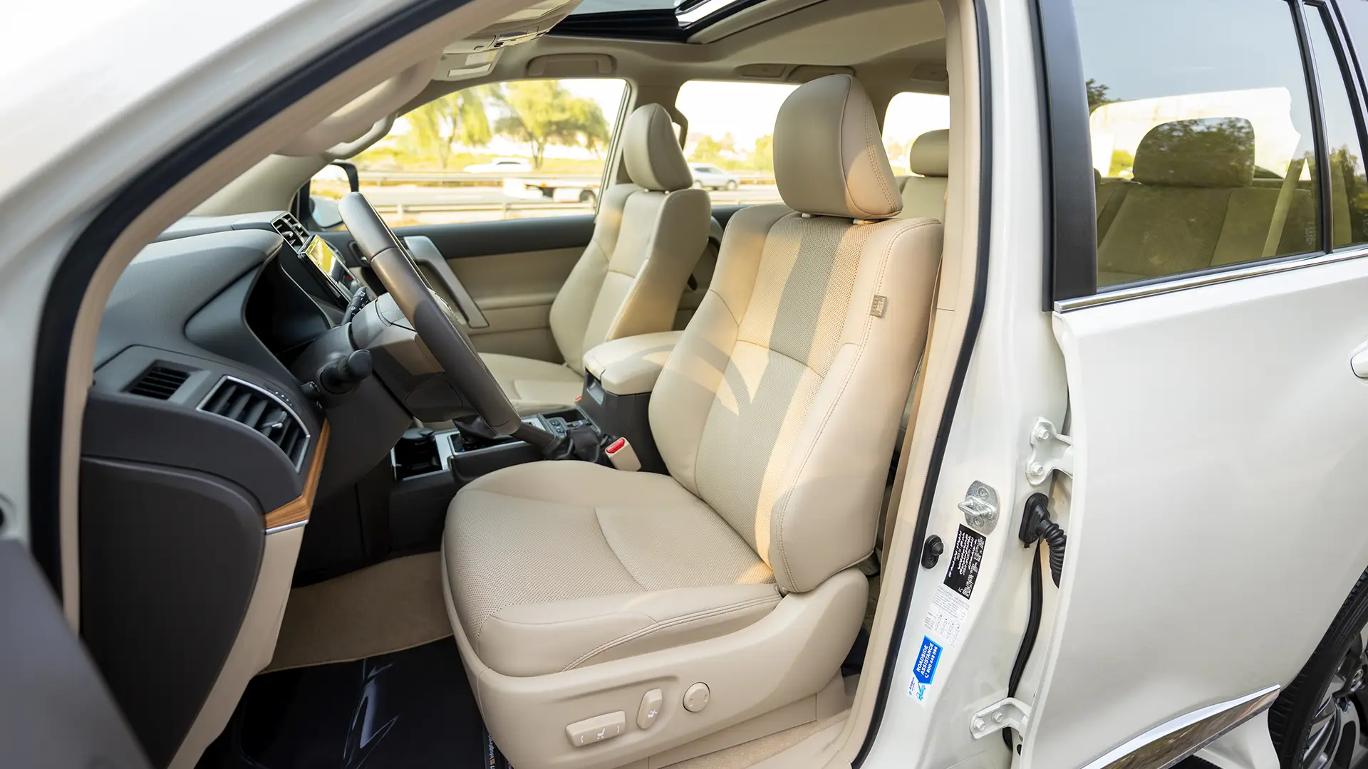Used 2023 Toyota Prado VXR in White – Front Driver Side Cabin View for Sale at First Choice Cars Dubai Sharjah