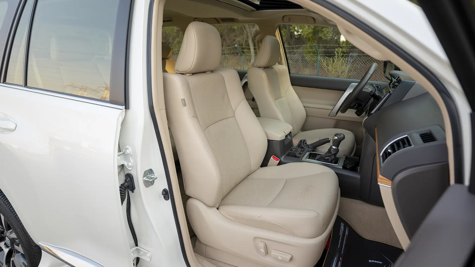 Used 2023 Toyota Prado VXR in White – Front Passenger Side Cabin View for Sale at First Choice Cars Dubai Sharjah