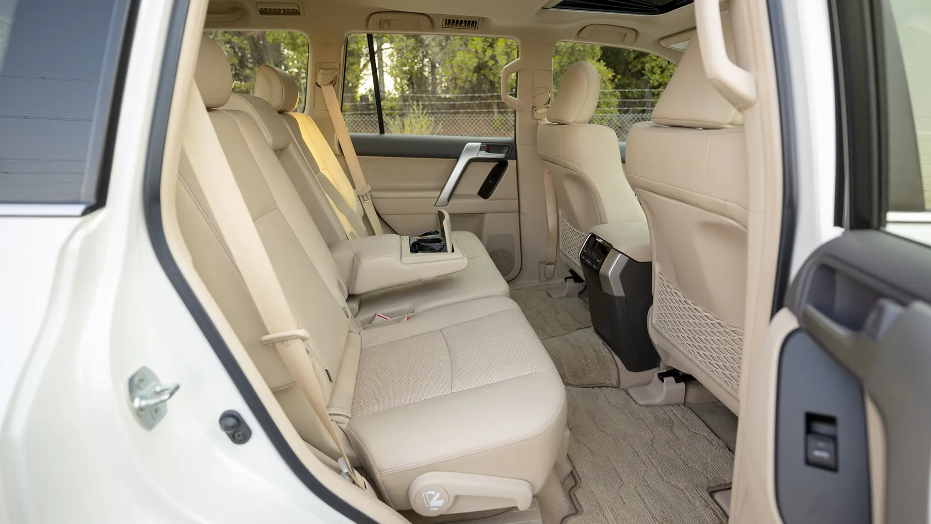 Used 2023 Toyota Prado VXR in White – Rear Passenger Side Cabin View for Sale at First Choice Cars Dubai Sharjah