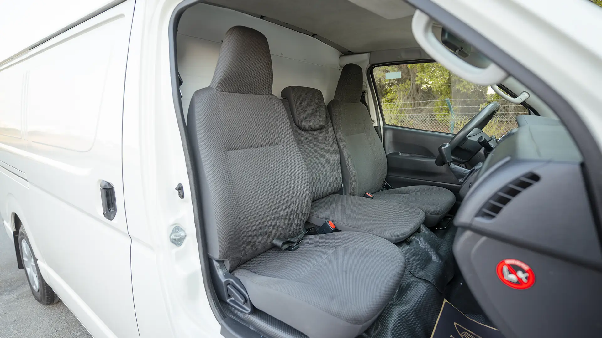 Used 2022 Toyota Hiace GL Standard Roof in White – Front Passenger Side Cabin View for Sale at First Choice Cars Dubai Sharjah