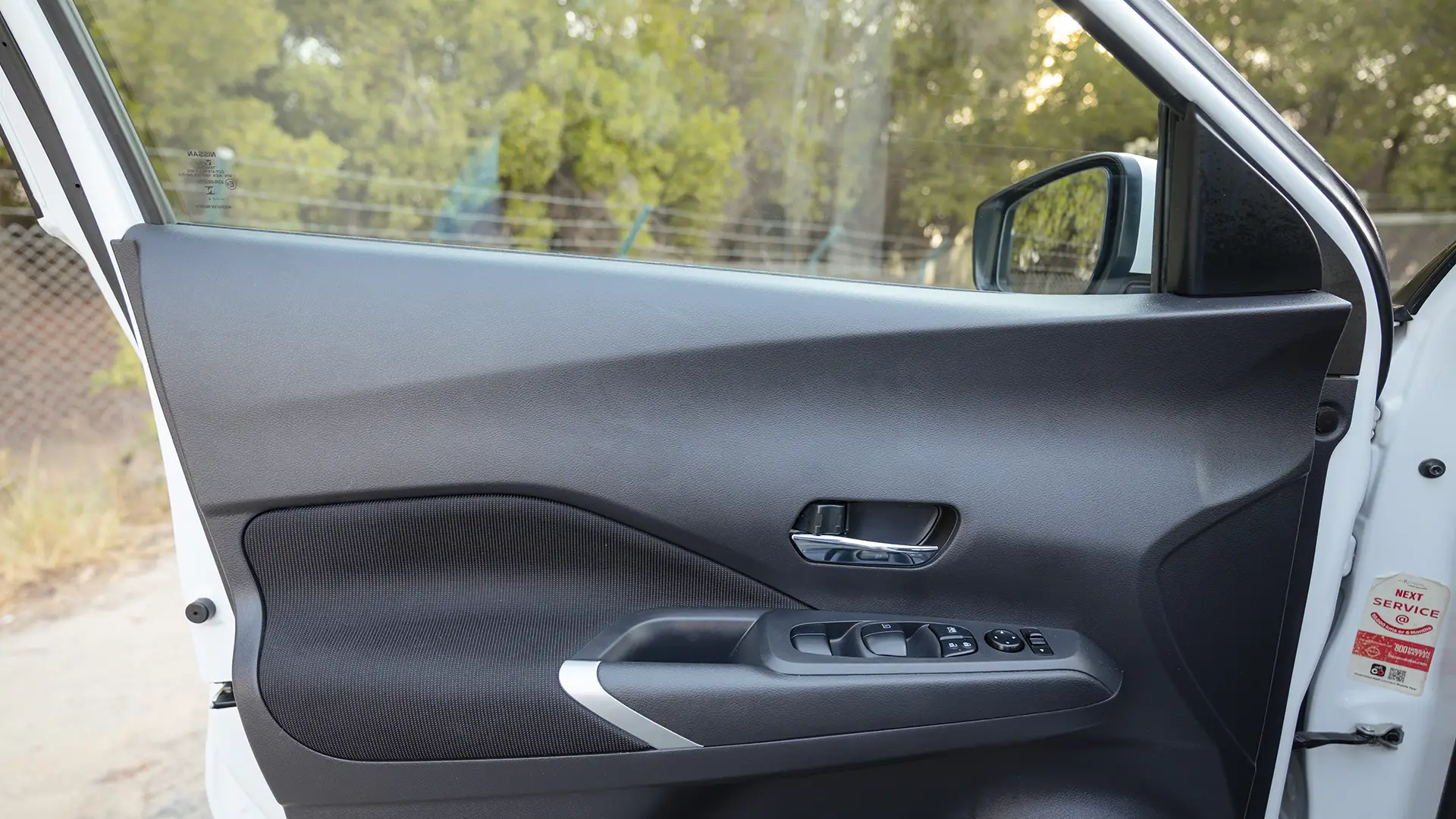 Used 2024 Nissan Kicks SV in White – Driver Door Panel Full View for Sale at First Choice Cars Dubai Sharjah