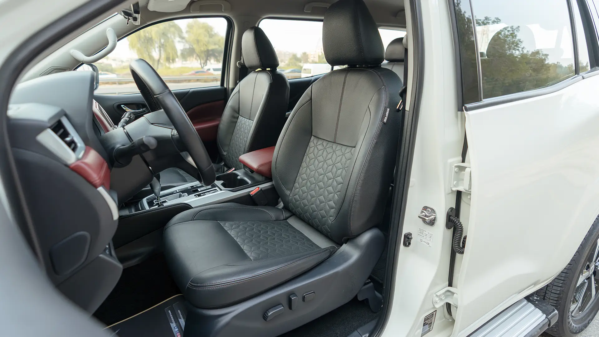 Used 2024 Nissan Xterra Platinum in White – Front Driver Side Cabin View for Sale at First Choice Cars Dubai Sharjah