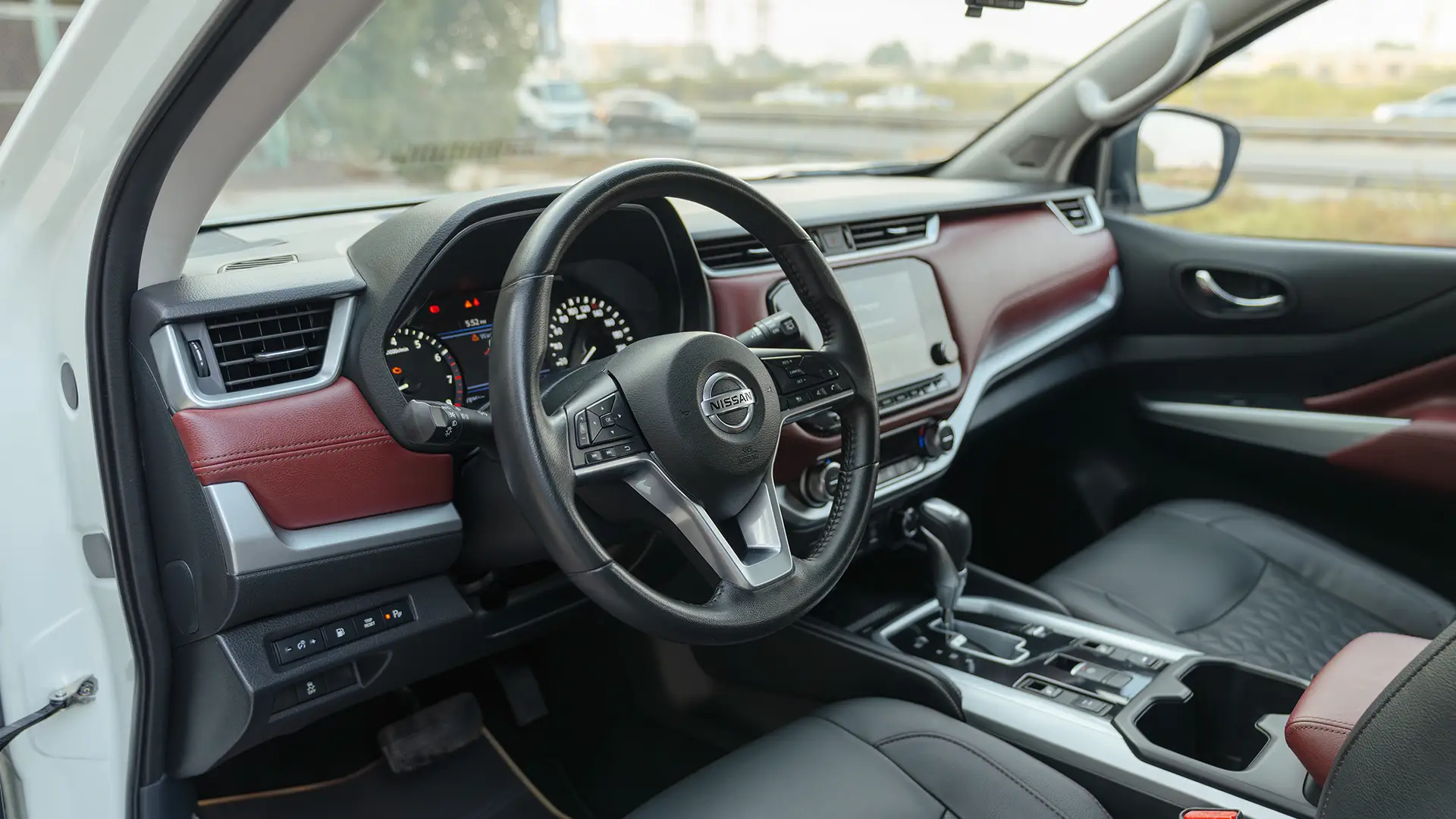 Used 2024 Nissan Xterra Platinum in White – Driver Side Dashboard & Steering View for Sale at First Choice Cars Dubai Sharjah