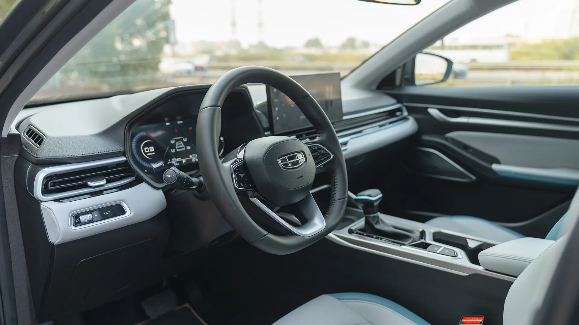 Used 2025 Geely Emgrand GF in Grey – Driver Side Dashboard & Steering View for Sale at First Choice Cars Dubai Sharjah