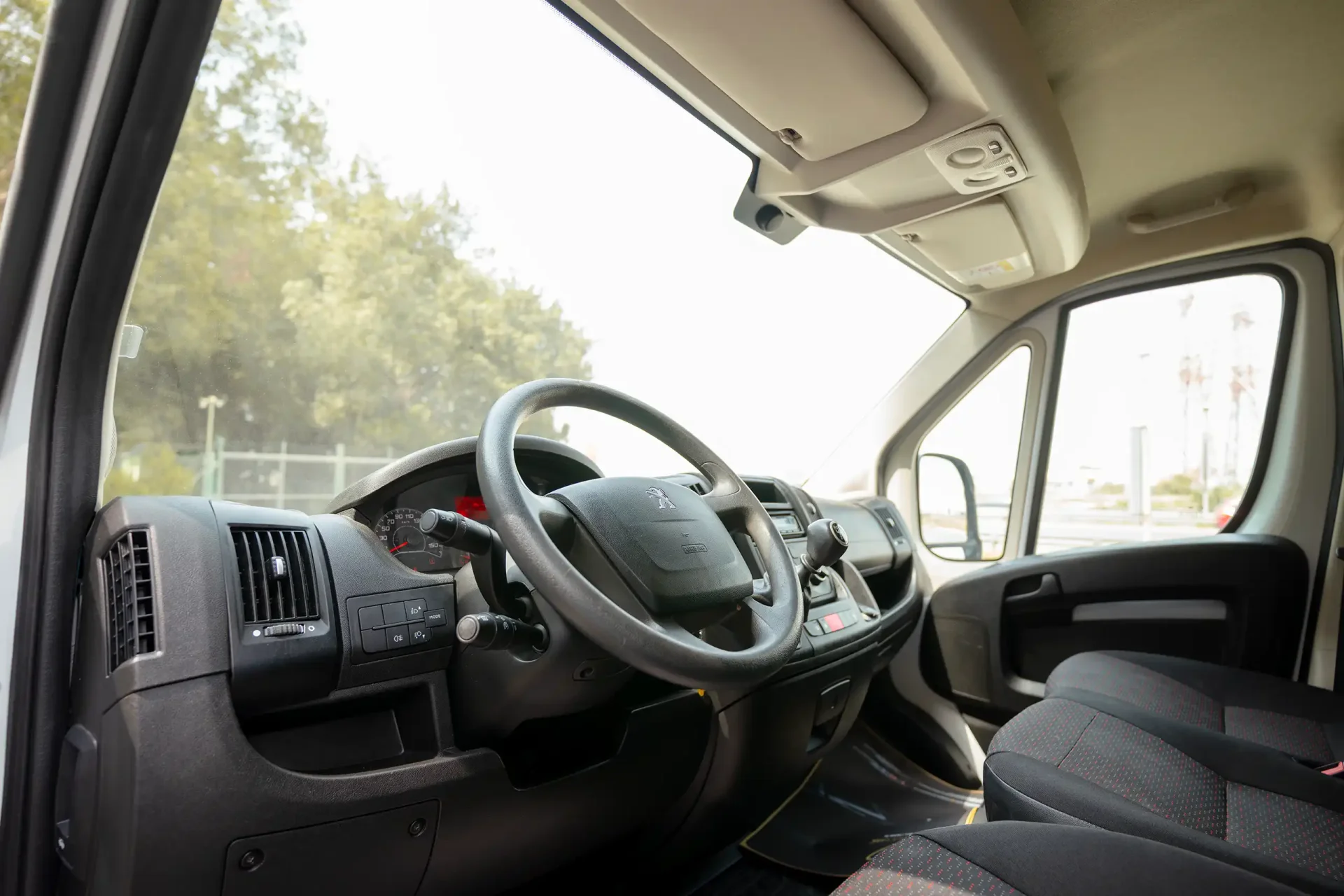 Used 2022 Peugeot Boxer L2H2 in White – Driver Side Dashboard & Steering View for Sale at First Choice Cars Dubai Sharjah