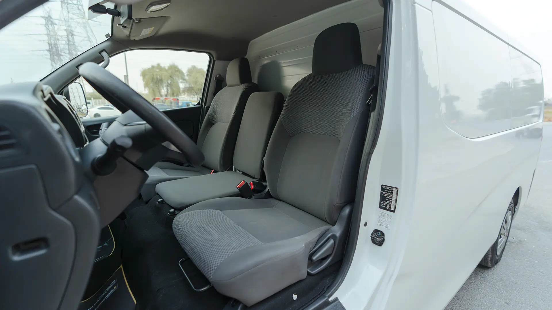 Used 2023 Nissan Urvan Standard Roof in White – Front Driver Side Cabin View for Sale at First Choice Cars Dubai Sharjah