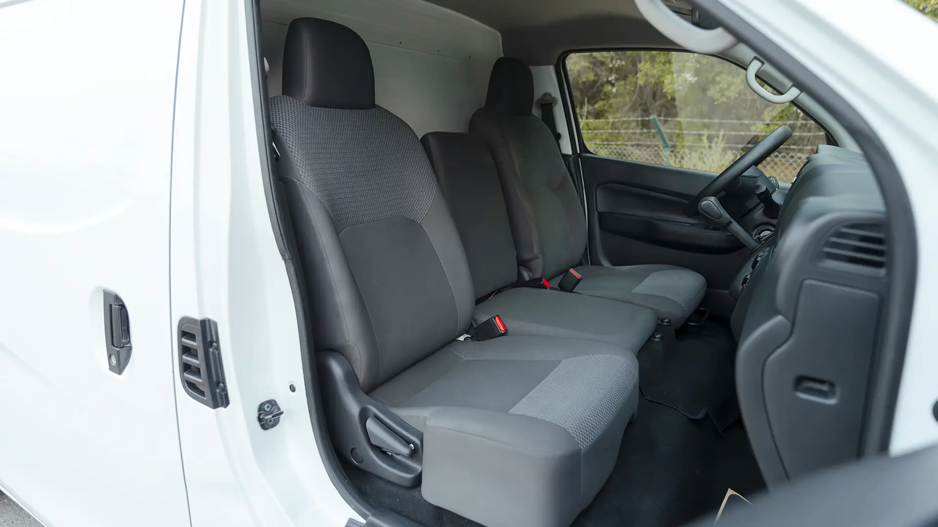 Used 2023 Nissan Urvan Standard Roof in White – Front Passenger Side Cabin View for Sale at First Choice Cars Dubai Sharjah