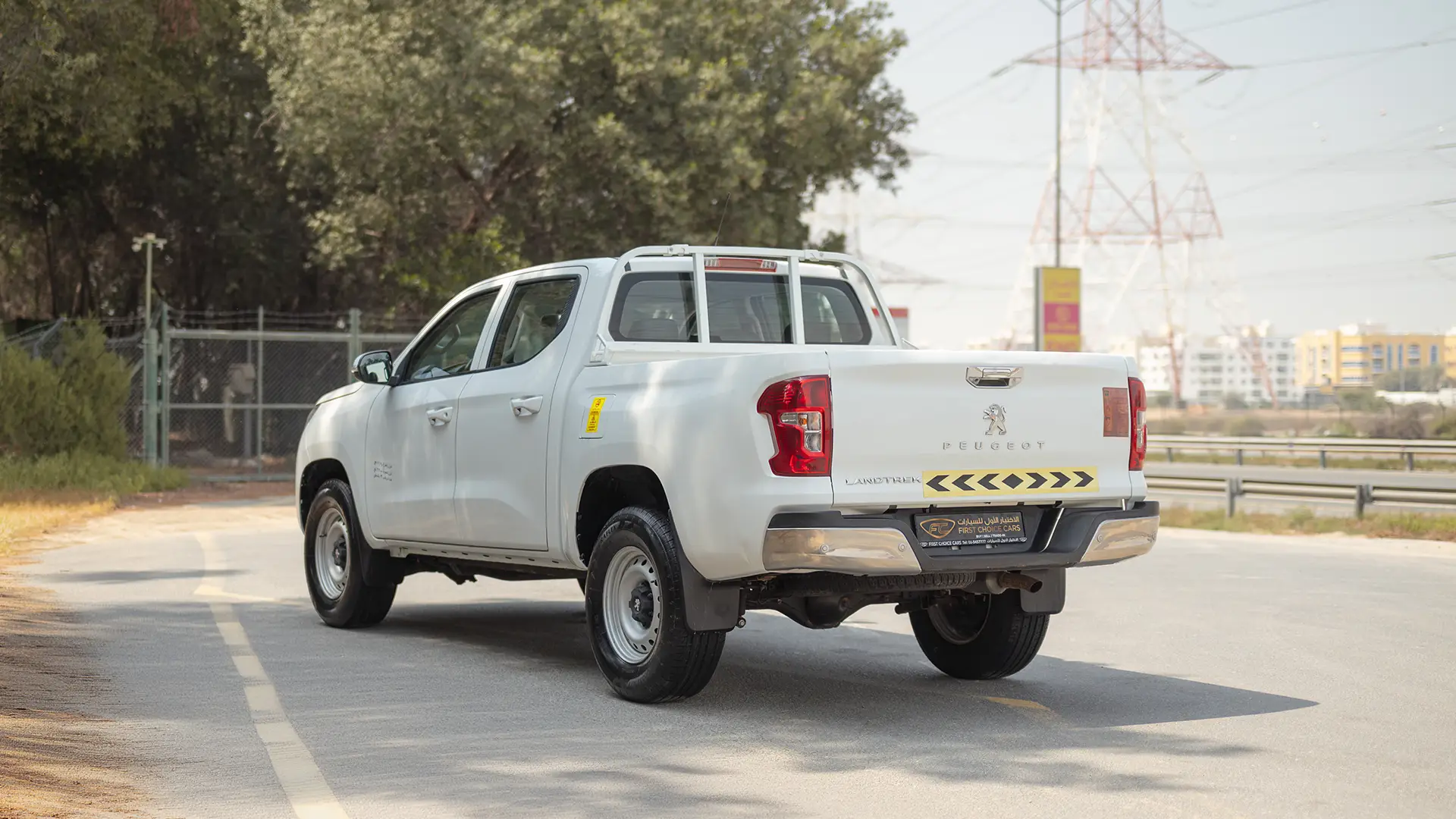 Used 2023 Peugeot Landtrek Double Cabin in White – Left Back Diagonal (45°) View for Sale at First Choice Cars Dubai Sharjah