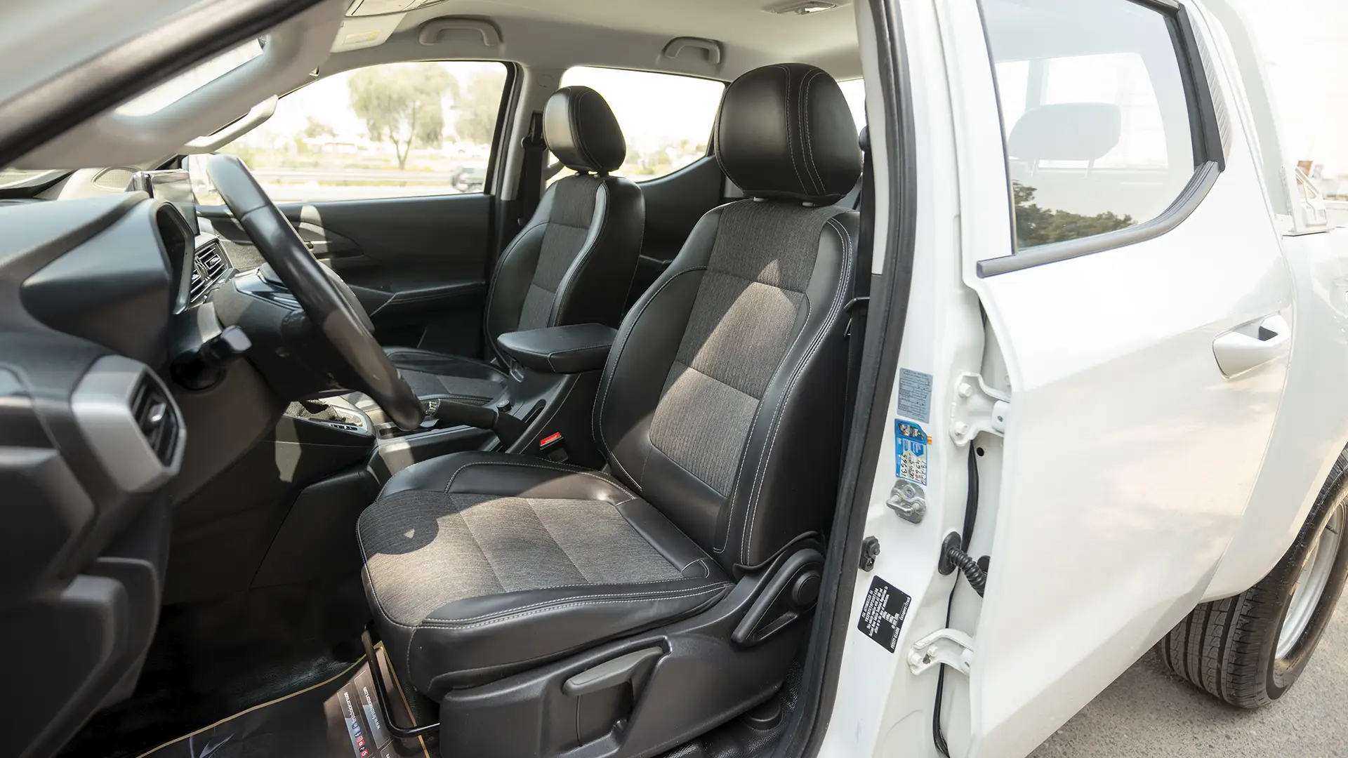 Used 2023 Peugeot Landtrek Double Cabin in White – Front Driver Side Cabin View for Sale at First Choice Cars Dubai Sharjah