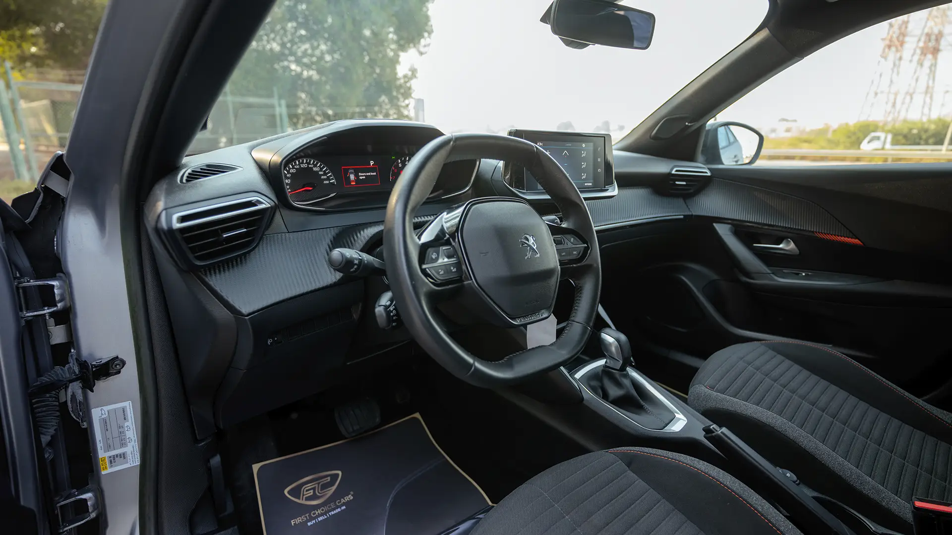 Used 2023 Peugeot 2008 Allure in Silver – Driver Side Dashboard & Steering View for Sale at First Choice Cars Dubai Sharjah