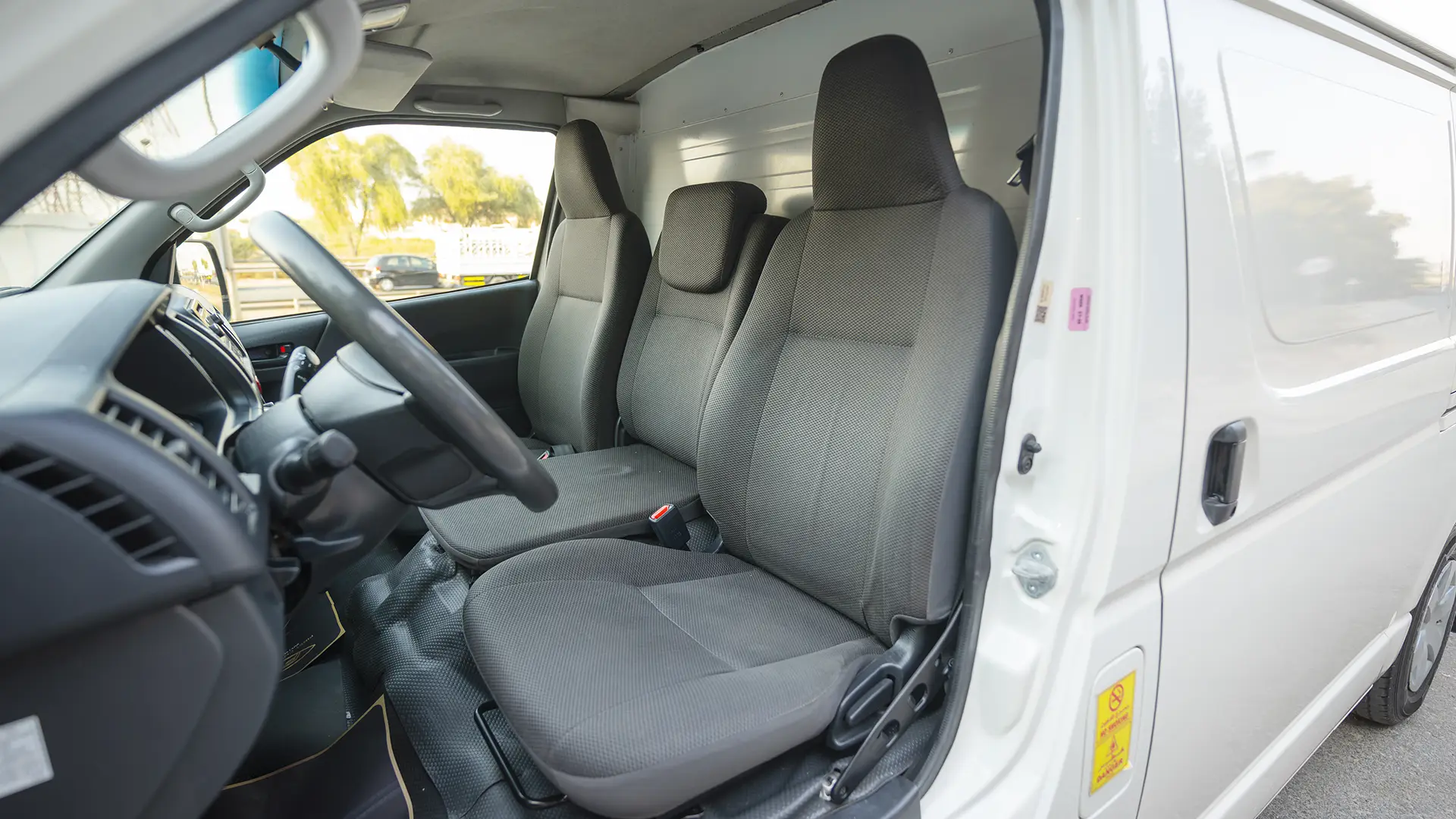 Used 2022 Toyota Hiace GL Standard Roof in White – Front Driver Side Cabin View for Sale at First Choice Cars Dubai Sharjah