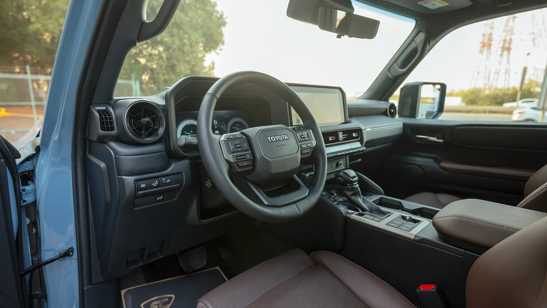 Used 2025 Toyota Prado Adventure in Blue – Driver Side Dashboard & Steering View for Sale at First Choice Cars Dubai Sharjah