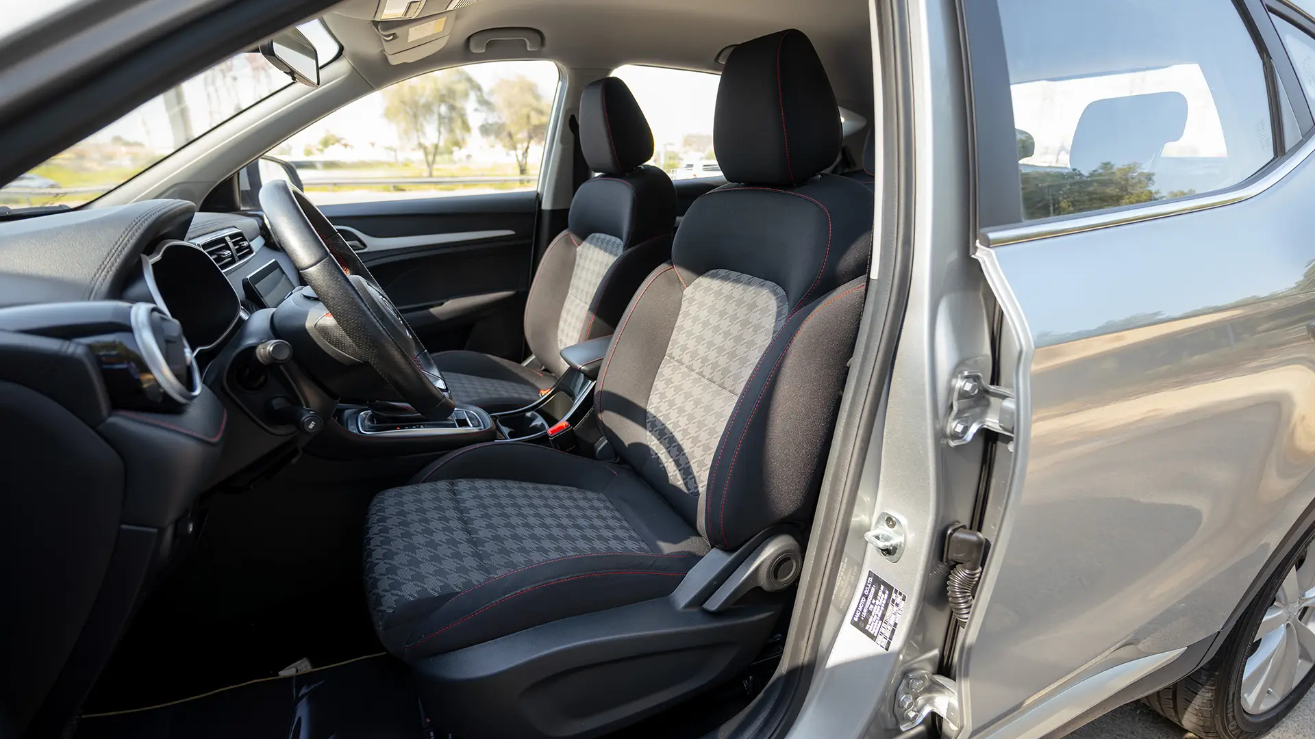 Used 2024 MG ZS Comfort in Silver – Front Driver Side Cabin View for Sale at First Choice Cars Dubai Sharjah