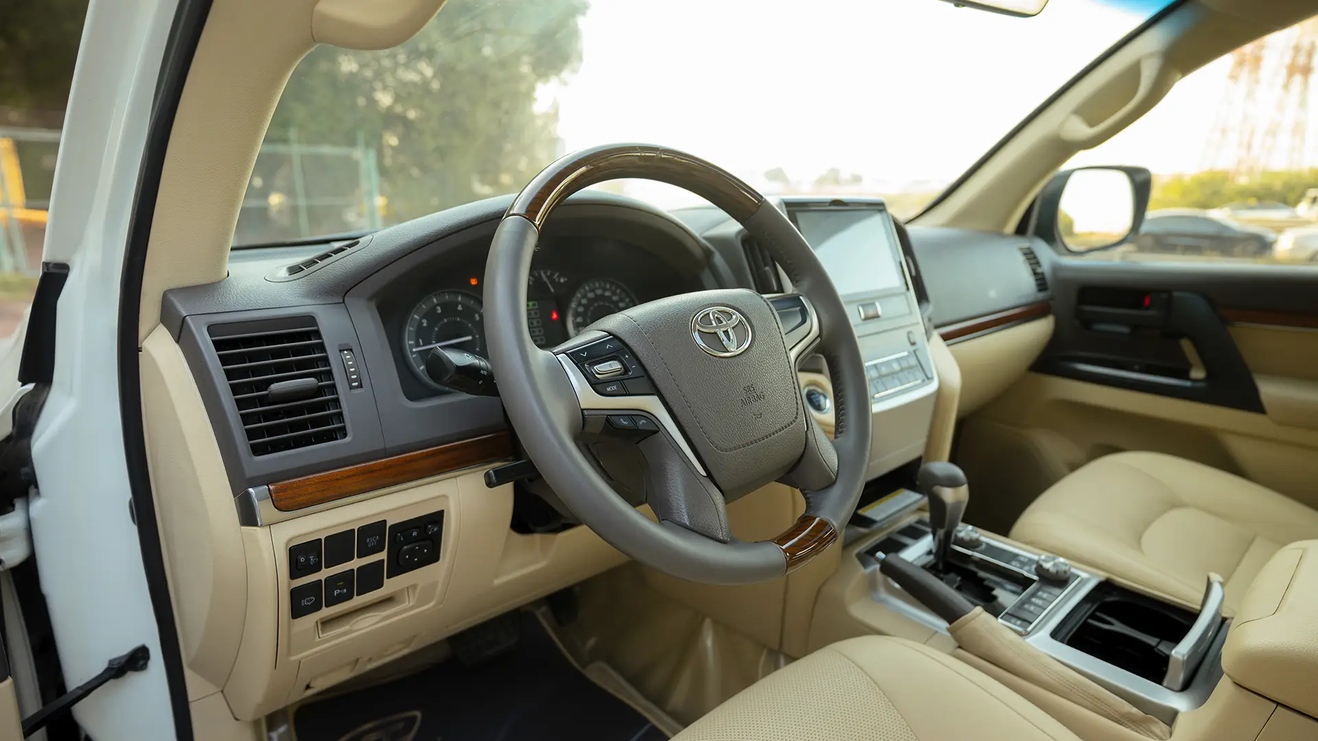 Used 2017 Toyota Land Cruiser GXR in White – Driver Side Dashboard & Steering View for Sale at First Choice Cars Dubai Sharjah