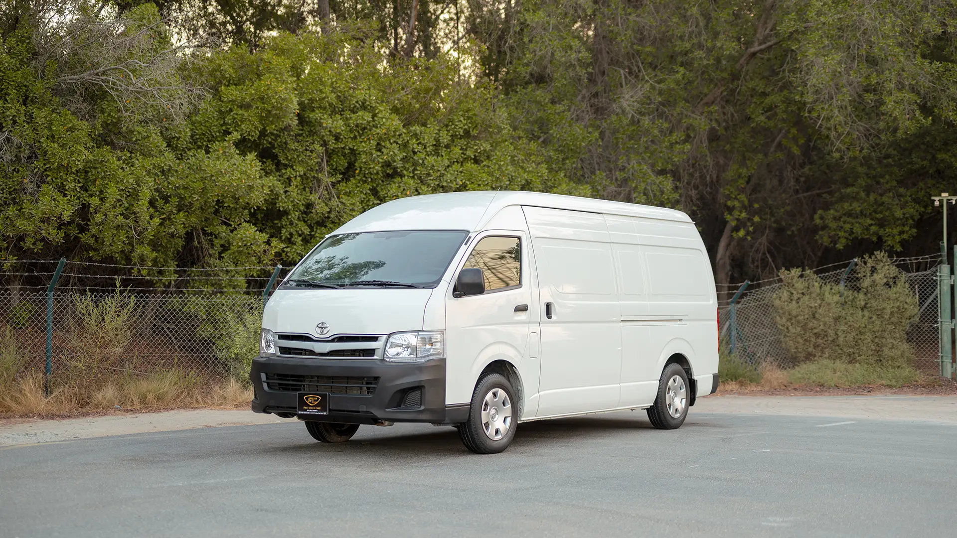 Used 2012 Toyota Hiace GL High Roof in White – Left Front Diagonal (45°) View for Sale at First Choice Cars Dubai Sharjah