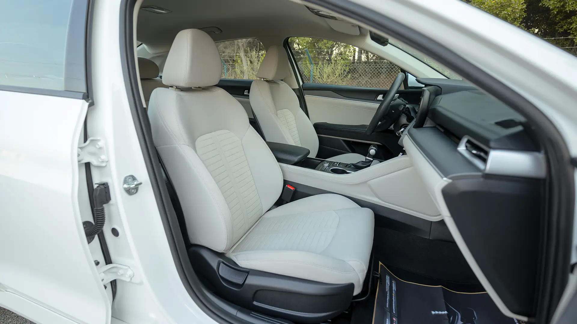 Used 2023 Kia K5 EX in White – Front Passenger Side Cabin View for Sale at First Choice Cars Dubai Sharjah