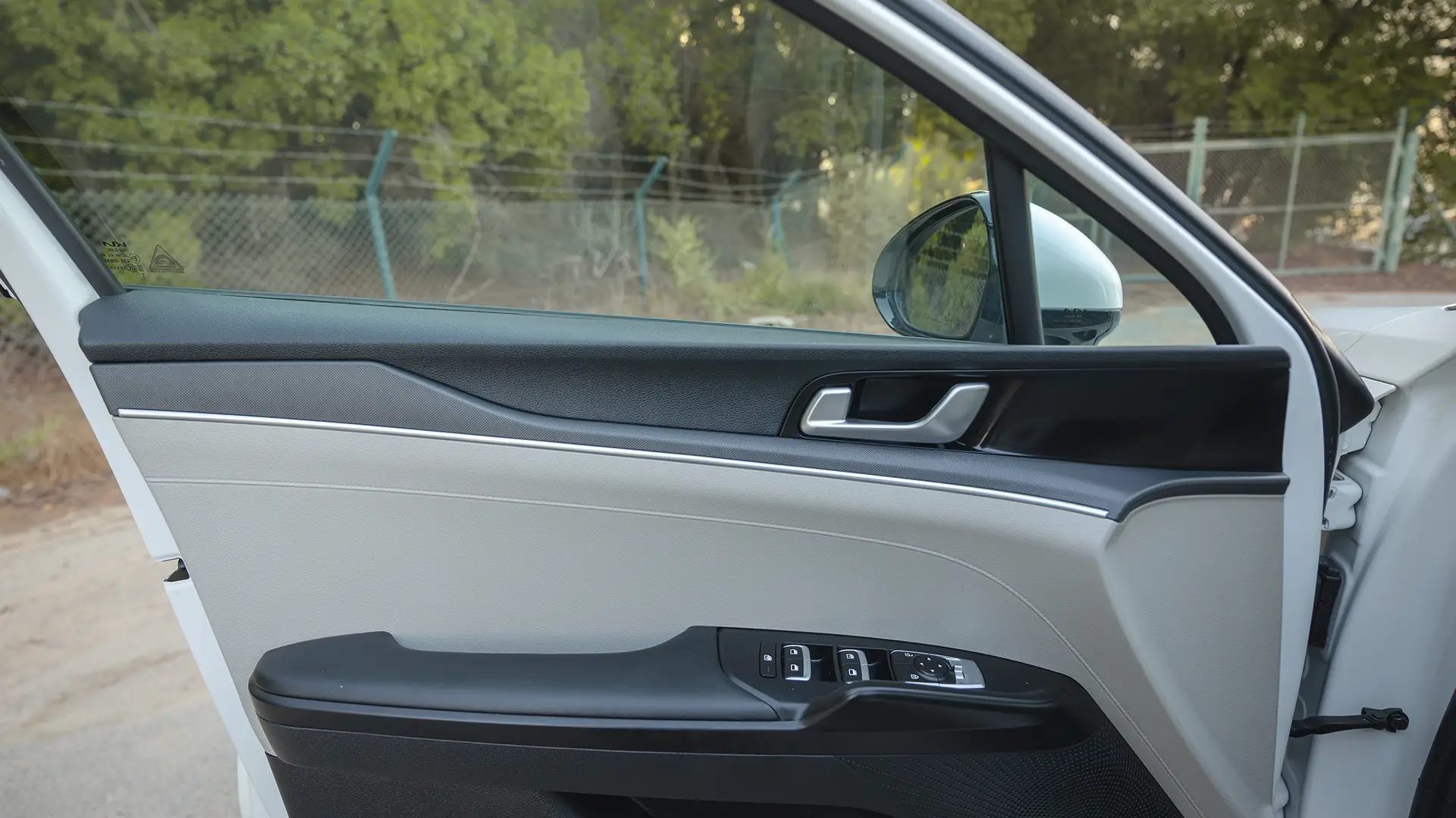 Used 2023 Kia K5 EX in White – Driver Door Panel Full View for Sale at First Choice Cars Dubai Sharjah