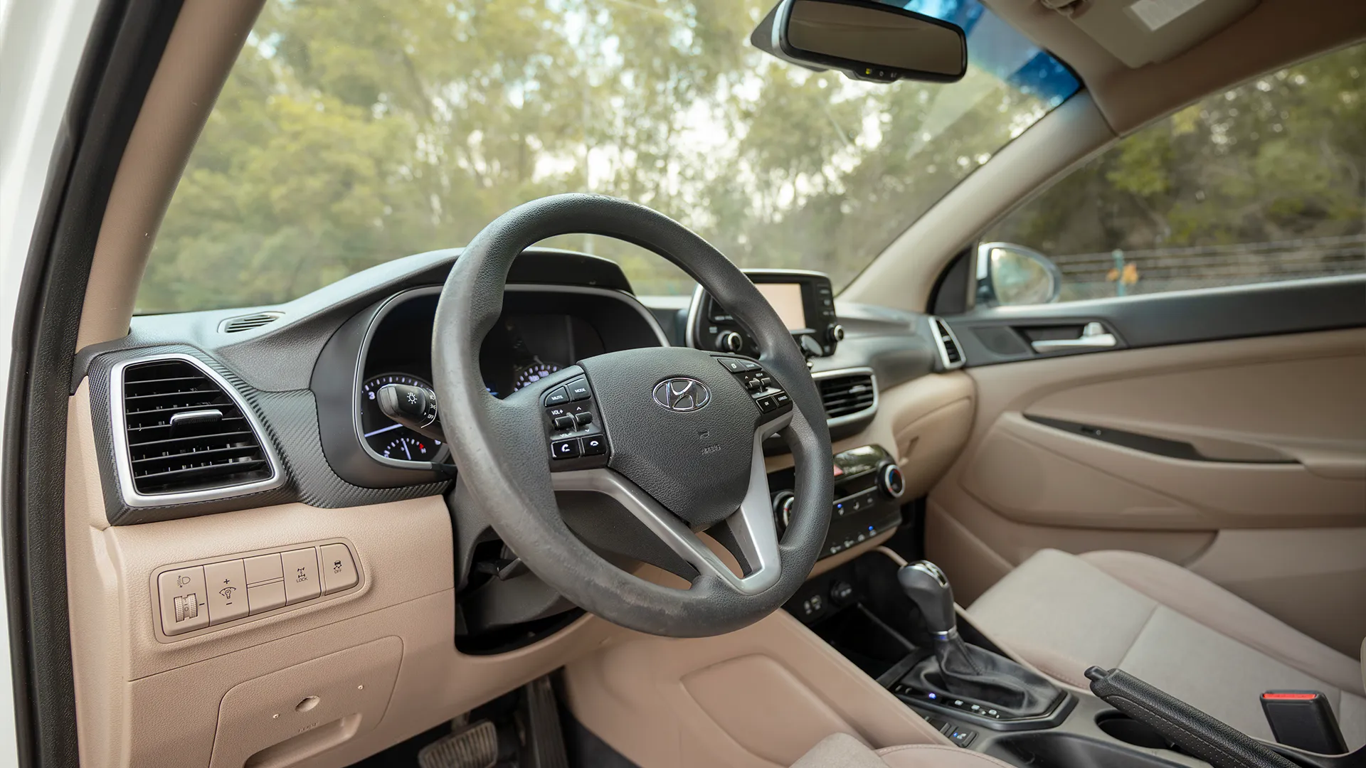Used 2020 Hyundai Tucson GLS in White – Driver Side Dashboard & Steering View for Sale at First Choice Cars Dubai Sharjah