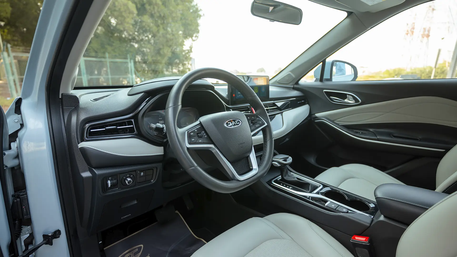 Used 2023 JAC JS4 Intelligent in Blue – Driver Side Dashboard & Steering View for Sale at First Choice Cars Dubai Sharjah