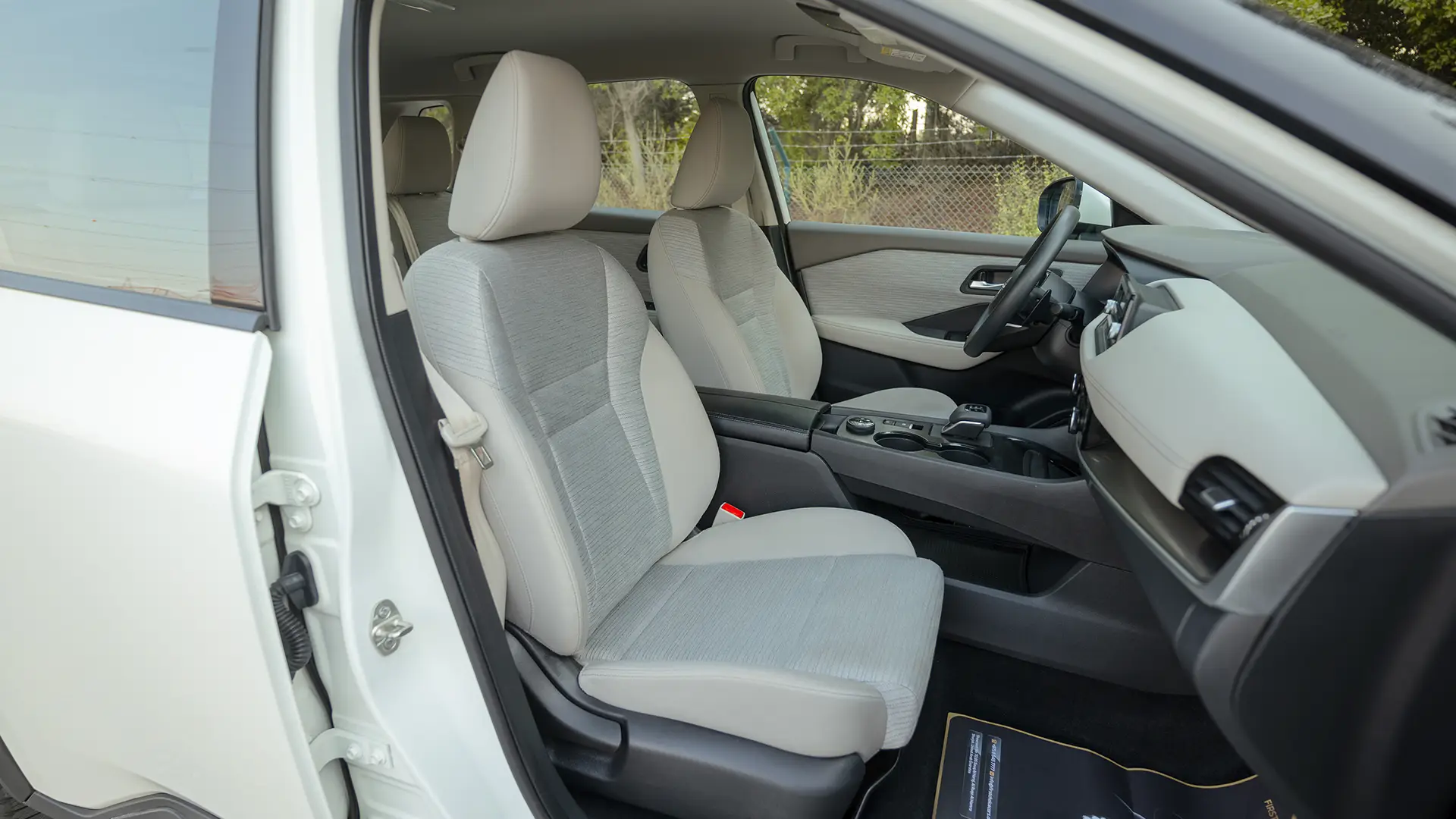 Used 2024 Nissan X-Trail S in White – Front Passenger Side Cabin View for Sale at First Choice Cars Dubai Sharjah